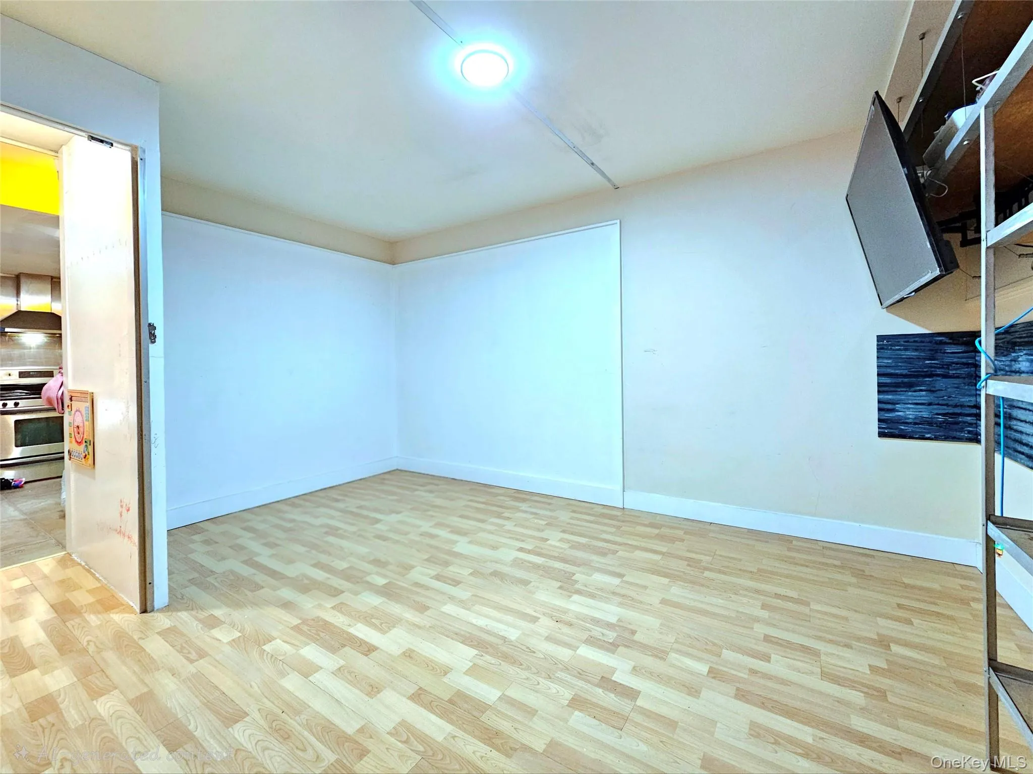 Below grade area featuring light wood-type flooring and baseboards Below grade area featuring light wood-type flooring and baseboards