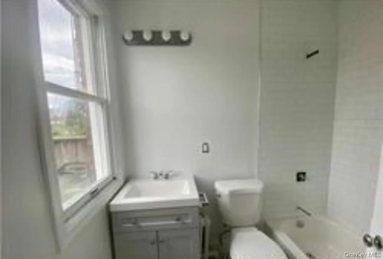 Full bath featuring vanity and bathtub / shower combination Full bath featuring vanity and bathtub / shower combination