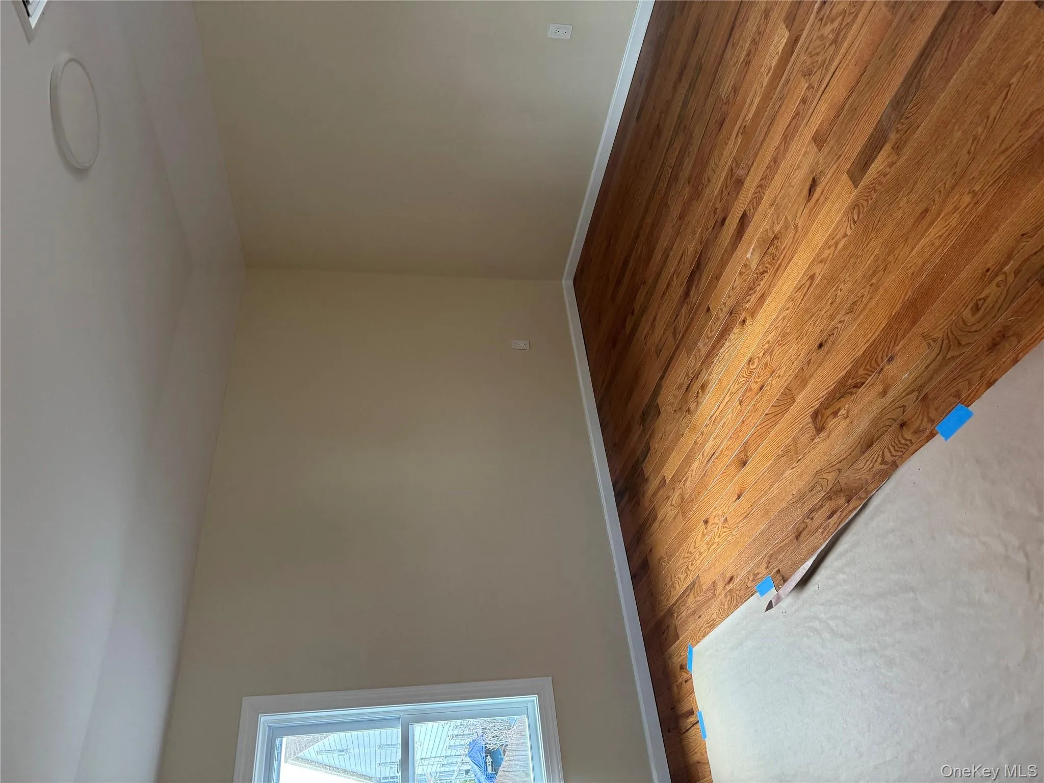 Empty room with light wood-style flooring and baseboards Empty room with light wood-style flooring and baseboards