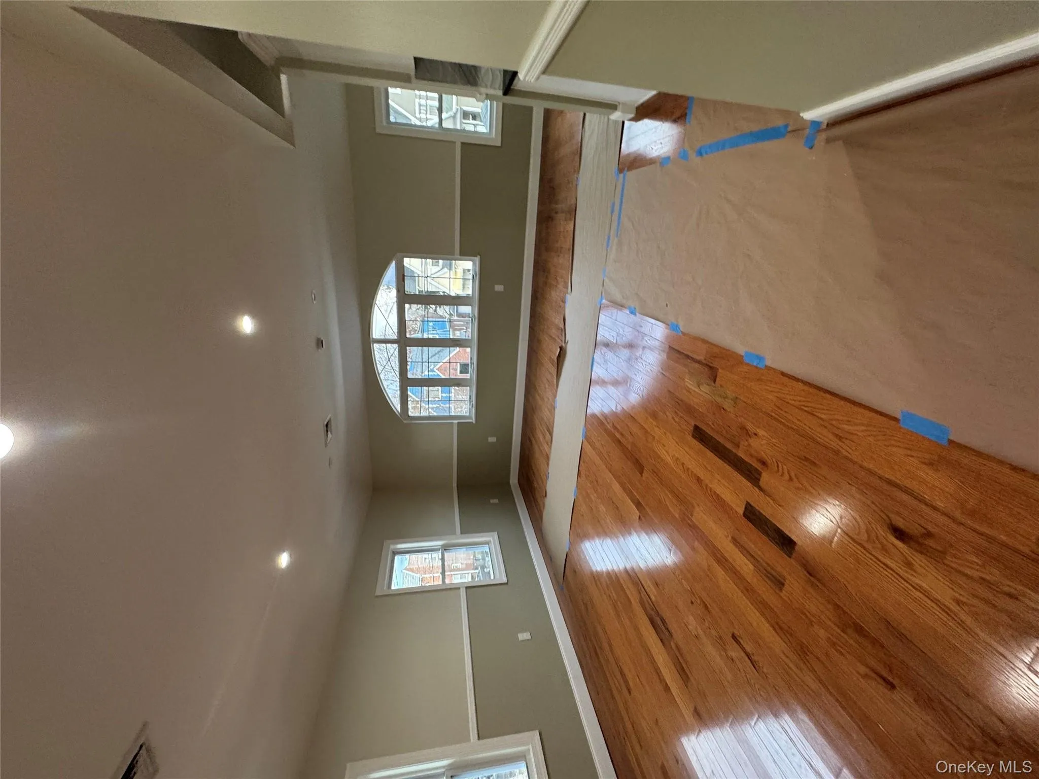 Empty room with hardwood / wood-style flooring and recessed lighting Empty room with hardwood / wood-style flooring and recessed lighting