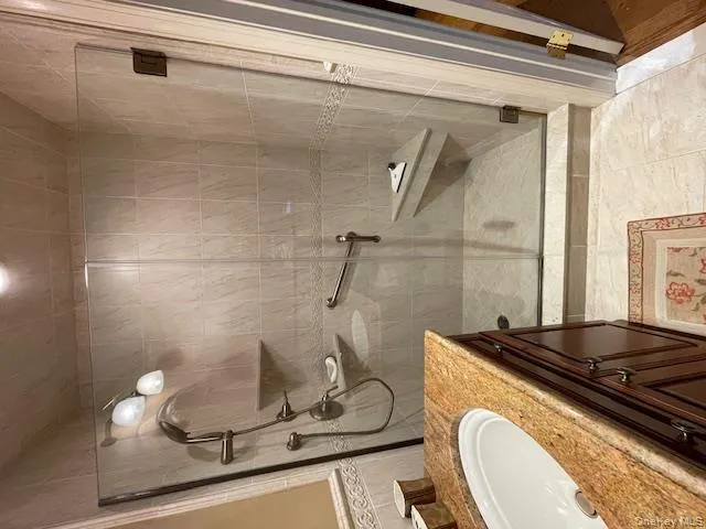 Bathroom with a stall shower and vanity Bathroom with a stall shower and vanity