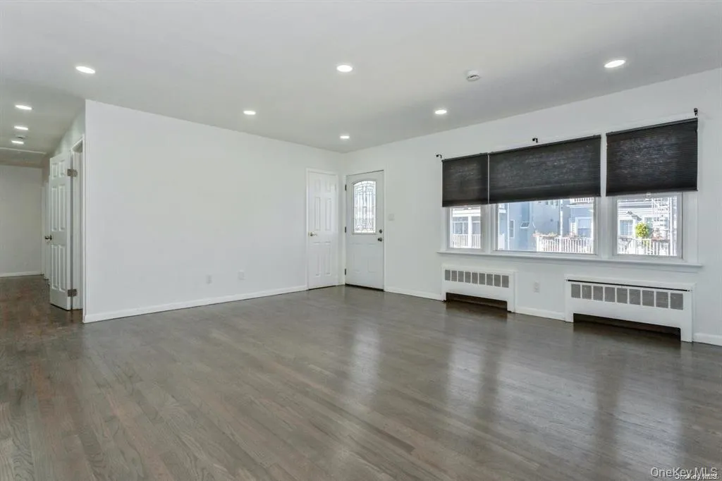 living room with recessed lighting, and wood flooring living room with recessed lighting, and wood flooring