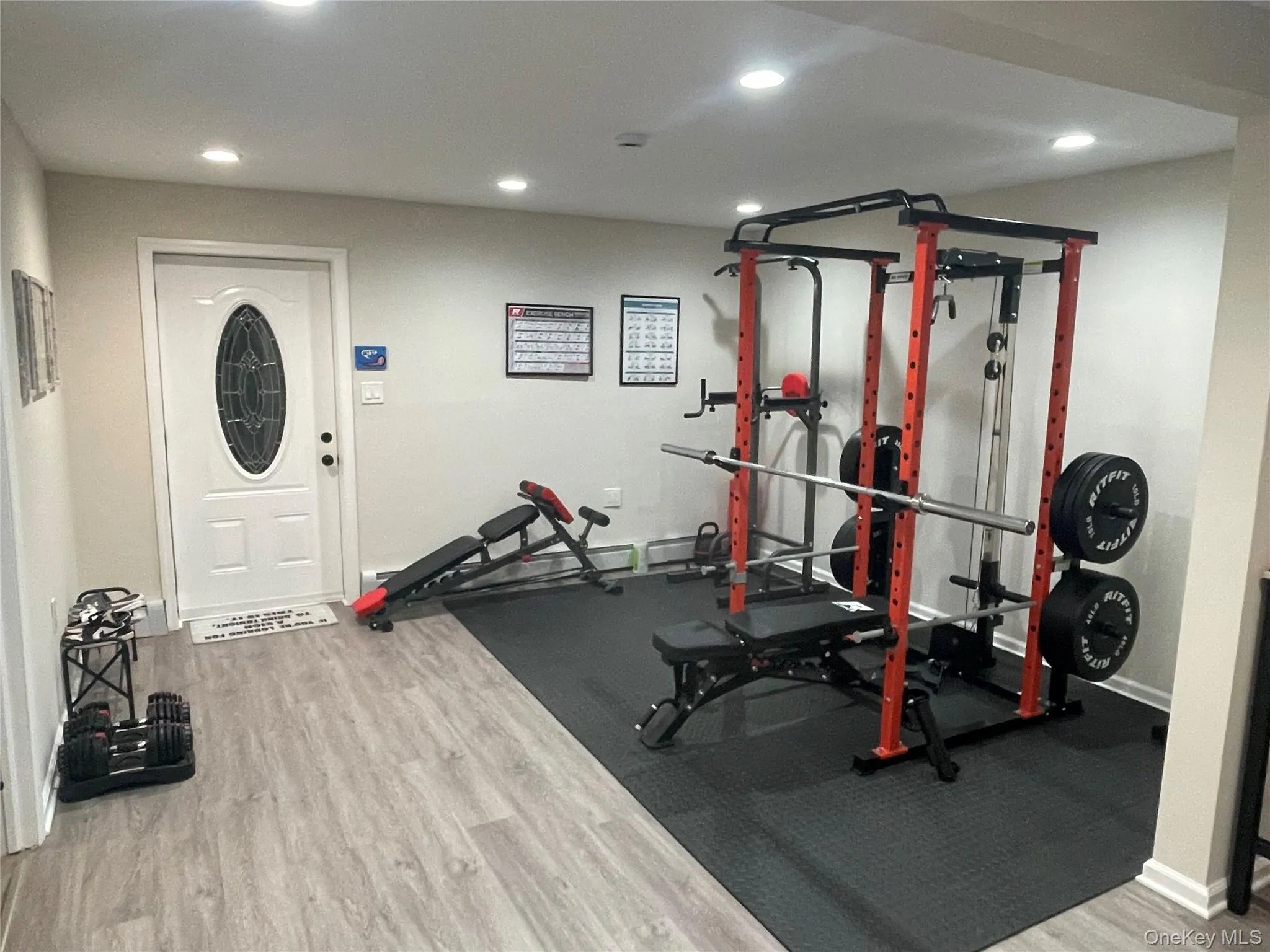 Workout room featuring light wood-style flooring and recessed lighting Workout room featuring light wood-style flooring and recessed lighting