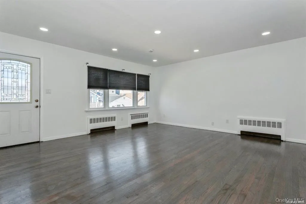 living room with wood flooring, and recessed lighting living room with wood flooring, and recessed lighting