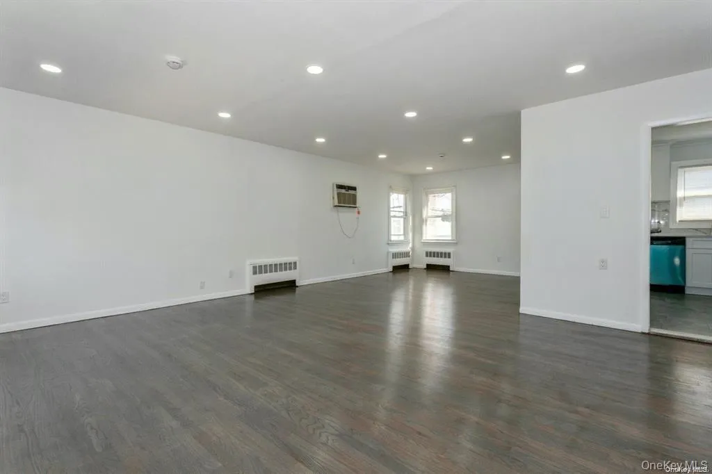 living room with recessed lighting, wood finished floors living room with recessed lighting, wood finished floors