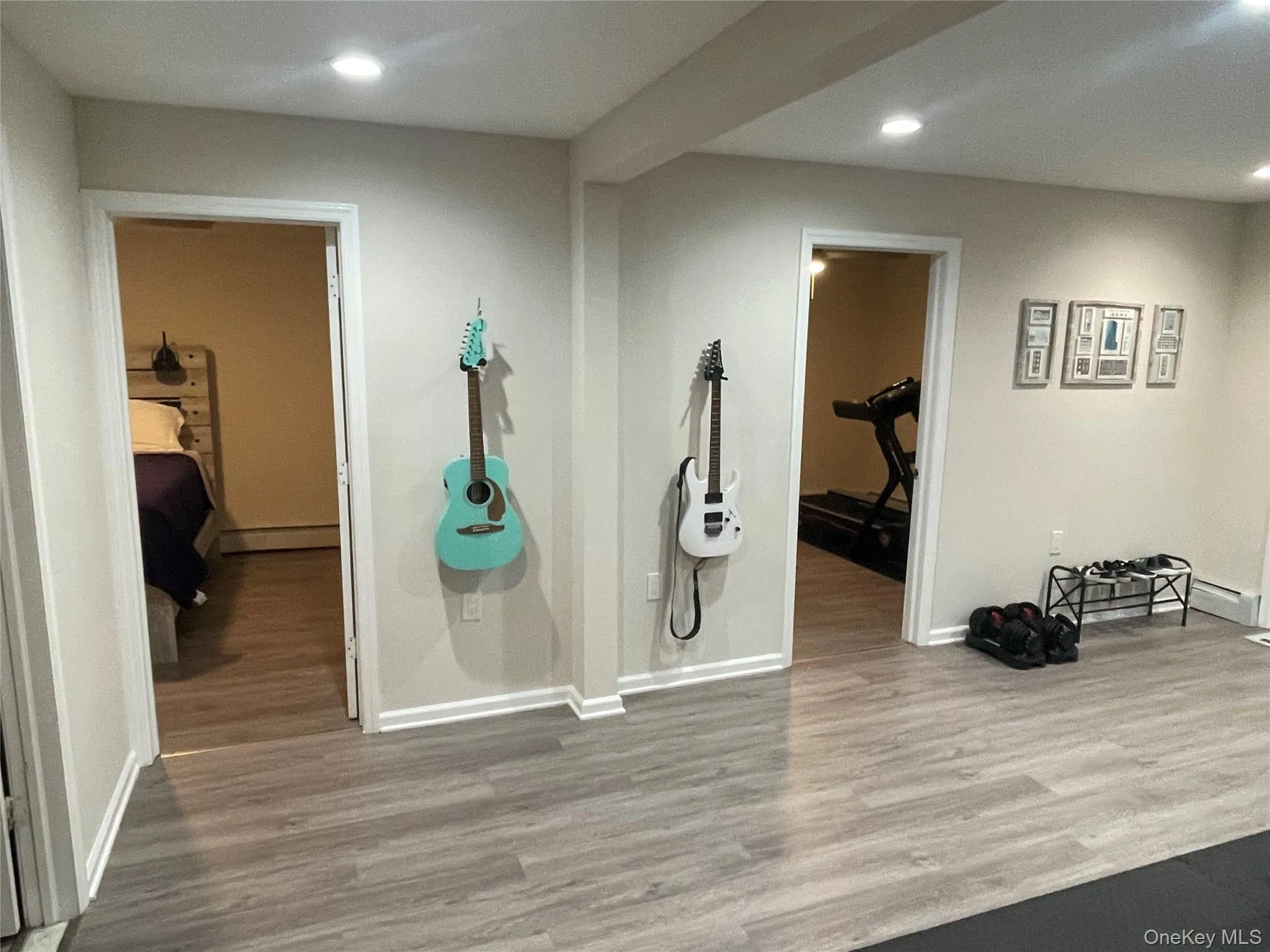 Workout area featuring recessed lighting and wood finished floors Workout area featuring recessed lighting and wood finished floors