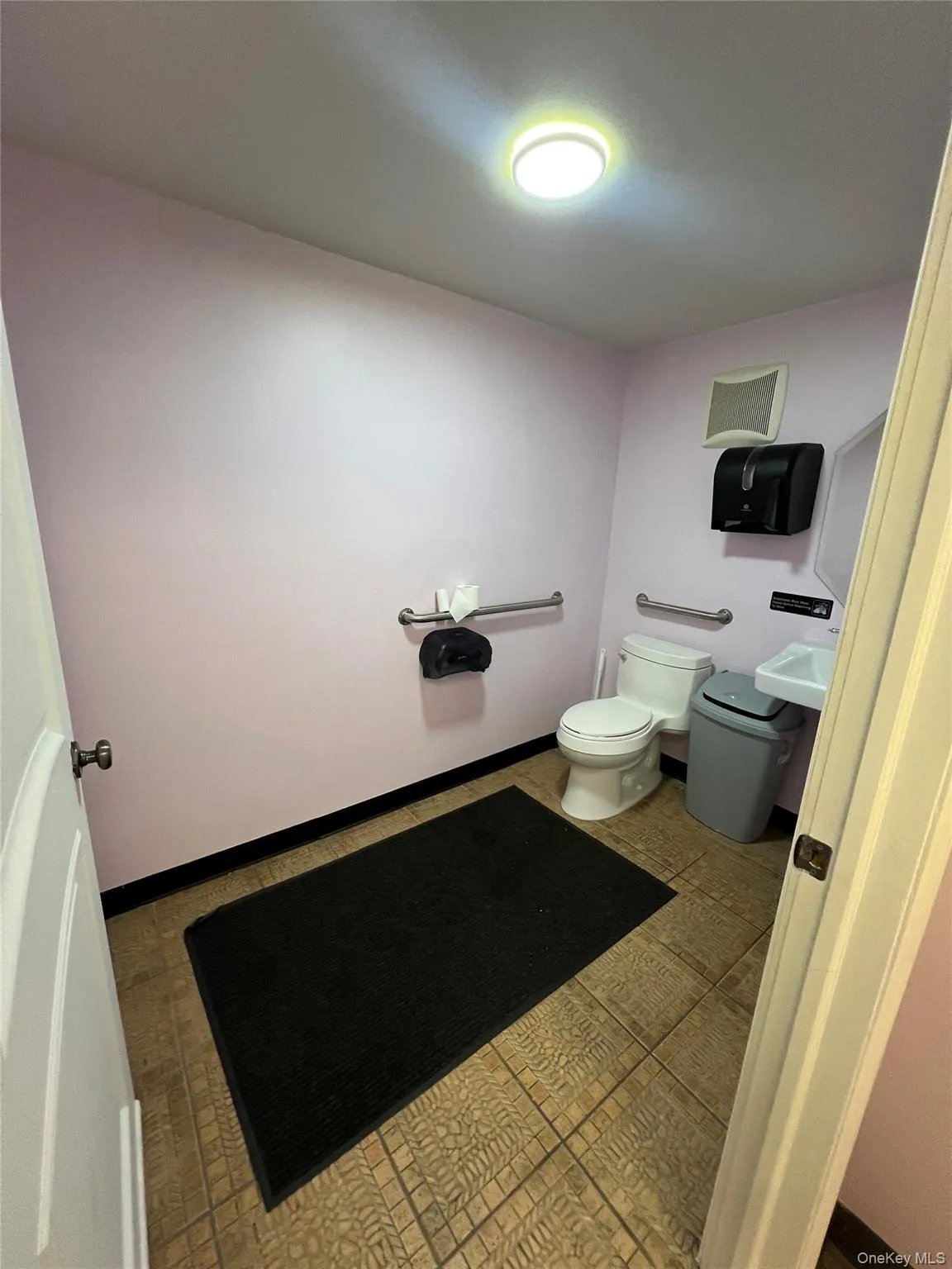 Half bath with toilet and baseboards Half bath with toilet and baseboards