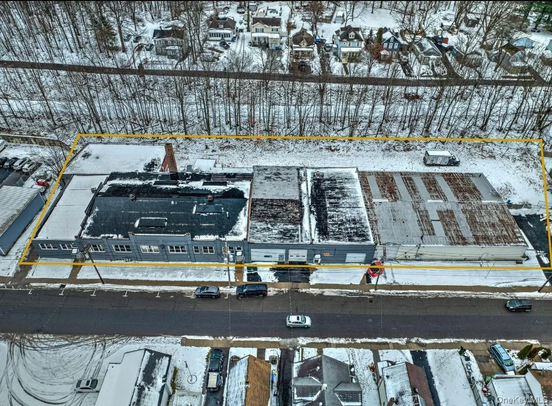 Snowy aerial view featuring a residential view Snowy aerial view featuring a residential view