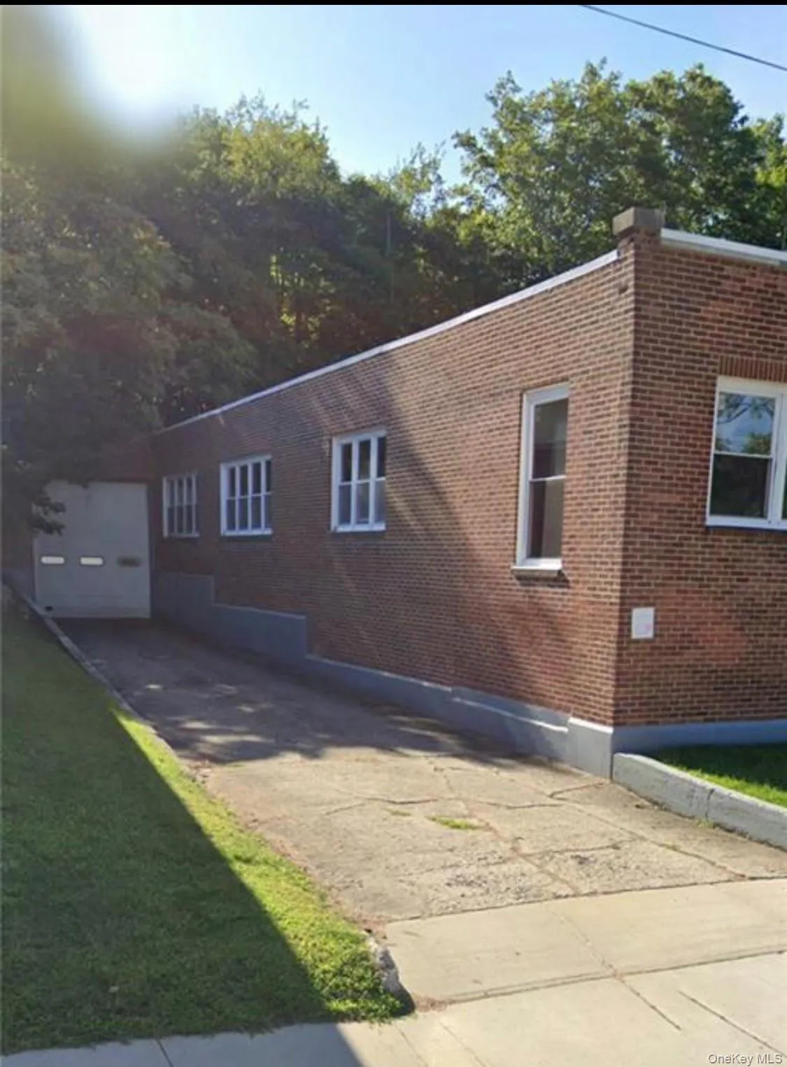 View of side of property featuring brick siding View of side of property featuring brick siding