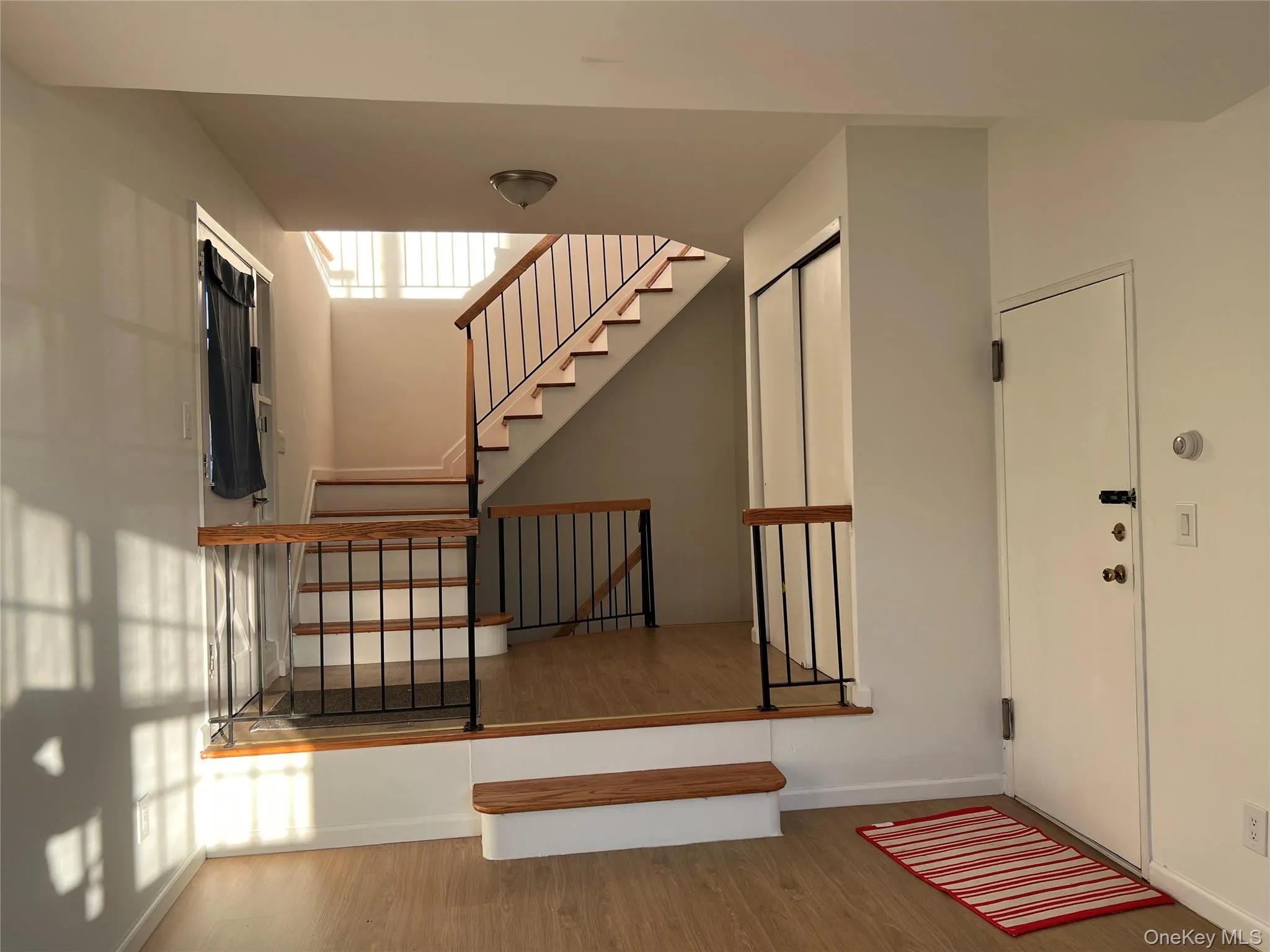 Stairs featuring baseboards and wood finished floors Stairs featuring baseboards and wood finished floors