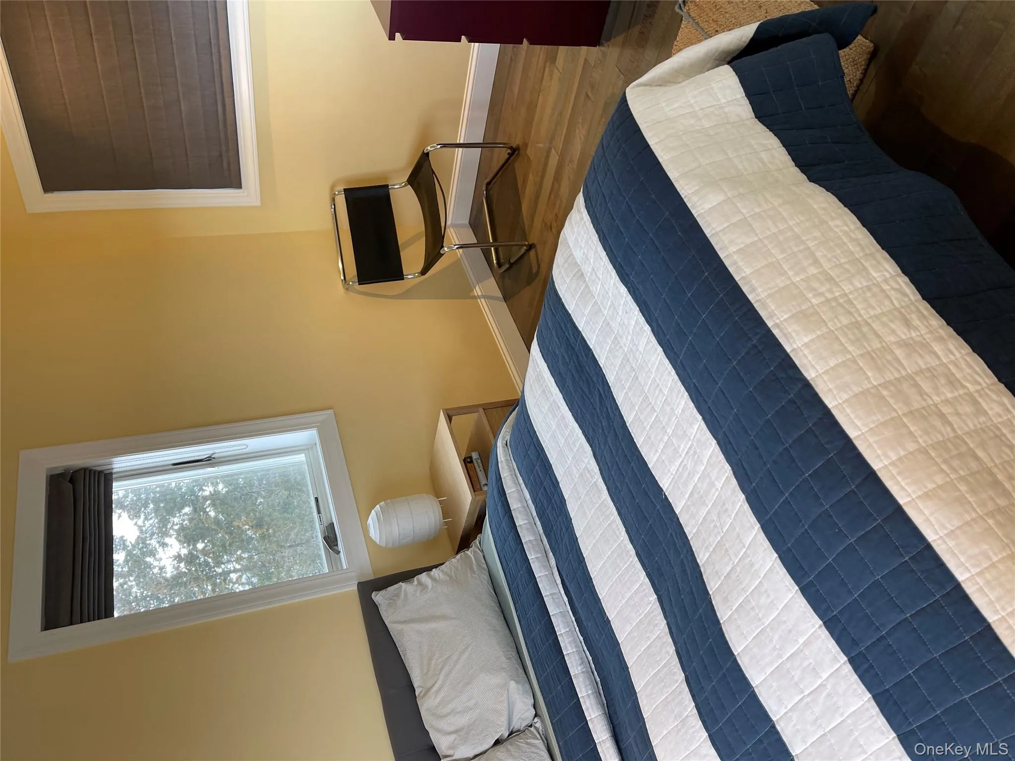 Bedroom with dark hardwood / wood-style flooring Bedroom with dark hardwood / wood-style flooring