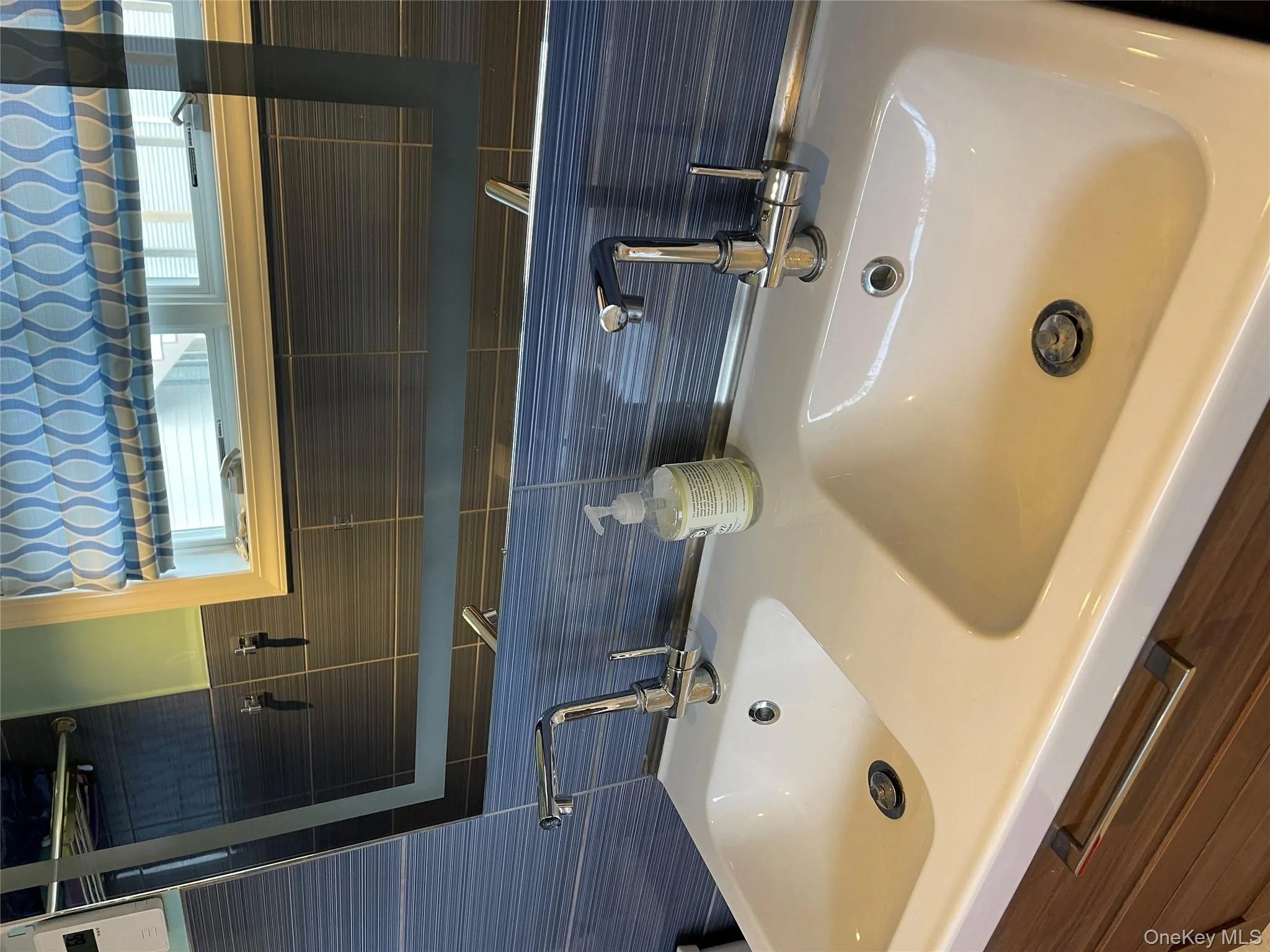 Bathroom with vanity and tile walls Bathroom with vanity and tile walls