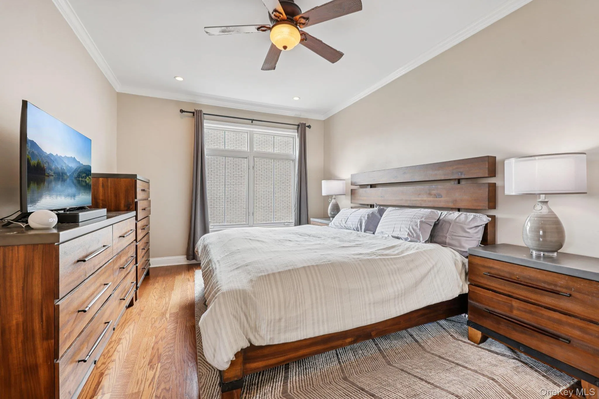 Primary suite featuring hardwood floors, walk in closet, recessed lighting and ceiling fan Primary suite featuring hardwood floors, walk in closet, recessed lighting and ceiling fan