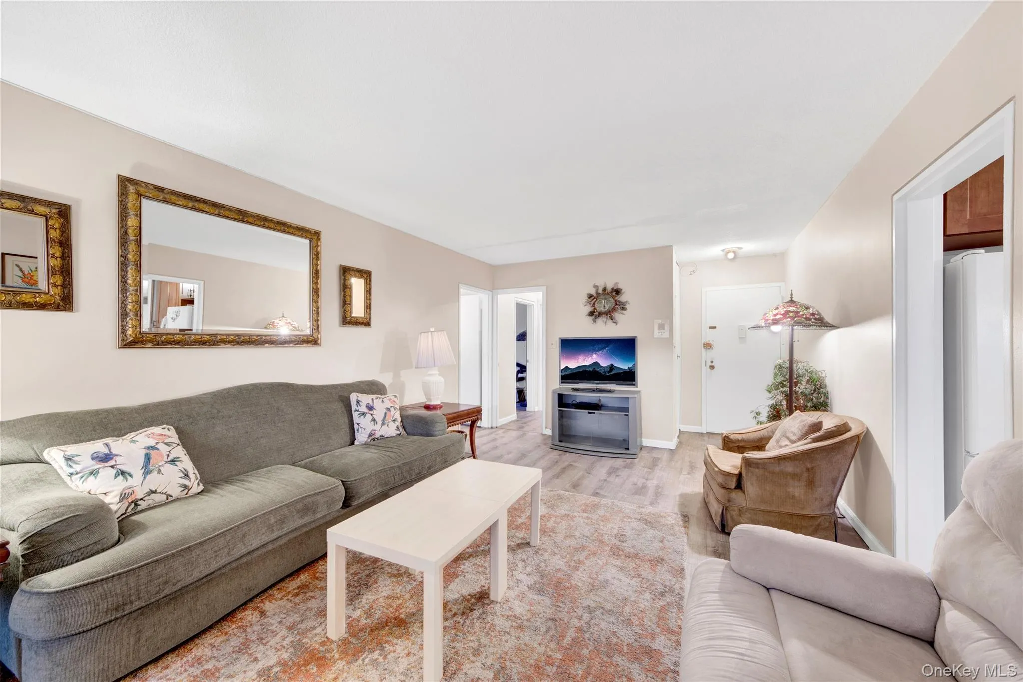 Living room featuring wood finished floors and baseboards Living room featuring wood finished floors and baseboards