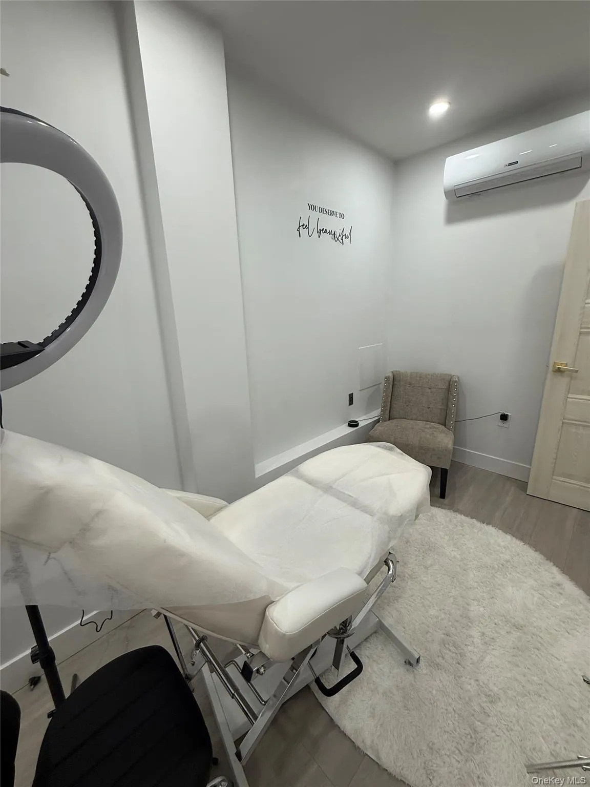 Bathroom featuring a wall mounted AC and recessed lighting Bathroom featuring a wall mounted AC and recessed lighting