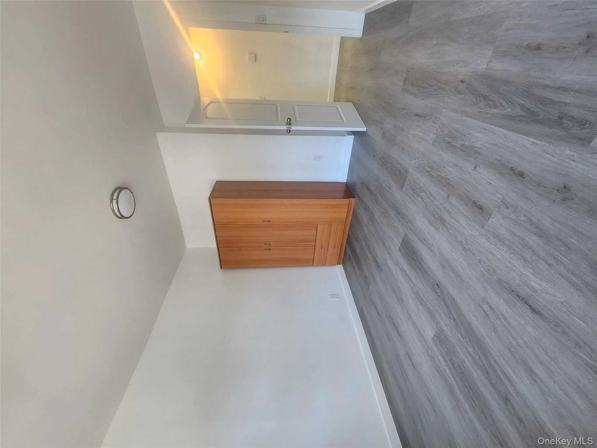 Unfurnished bedroom featuring wood finished floors and baseboards Unfurnished bedroom featuring wood finished floors and baseboards