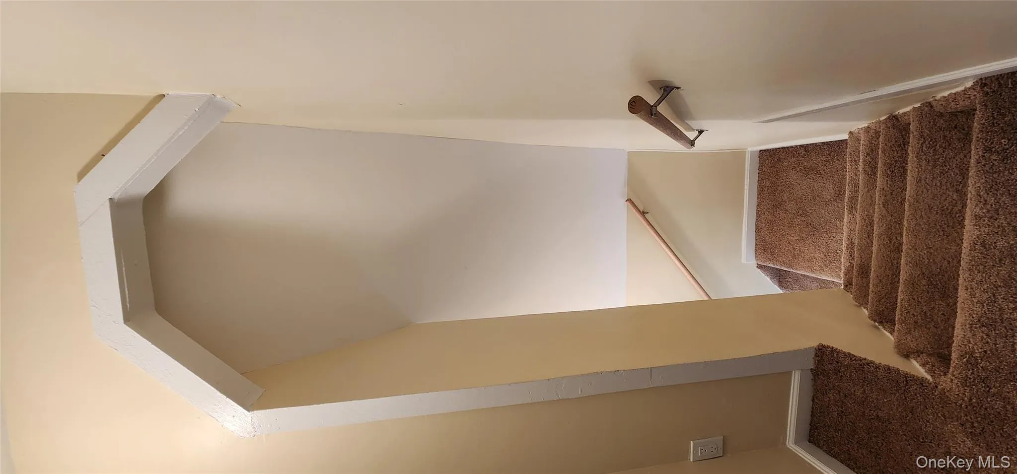 Stairway featuring carpet floors and baseboards Stairway featuring carpet floors and baseboards