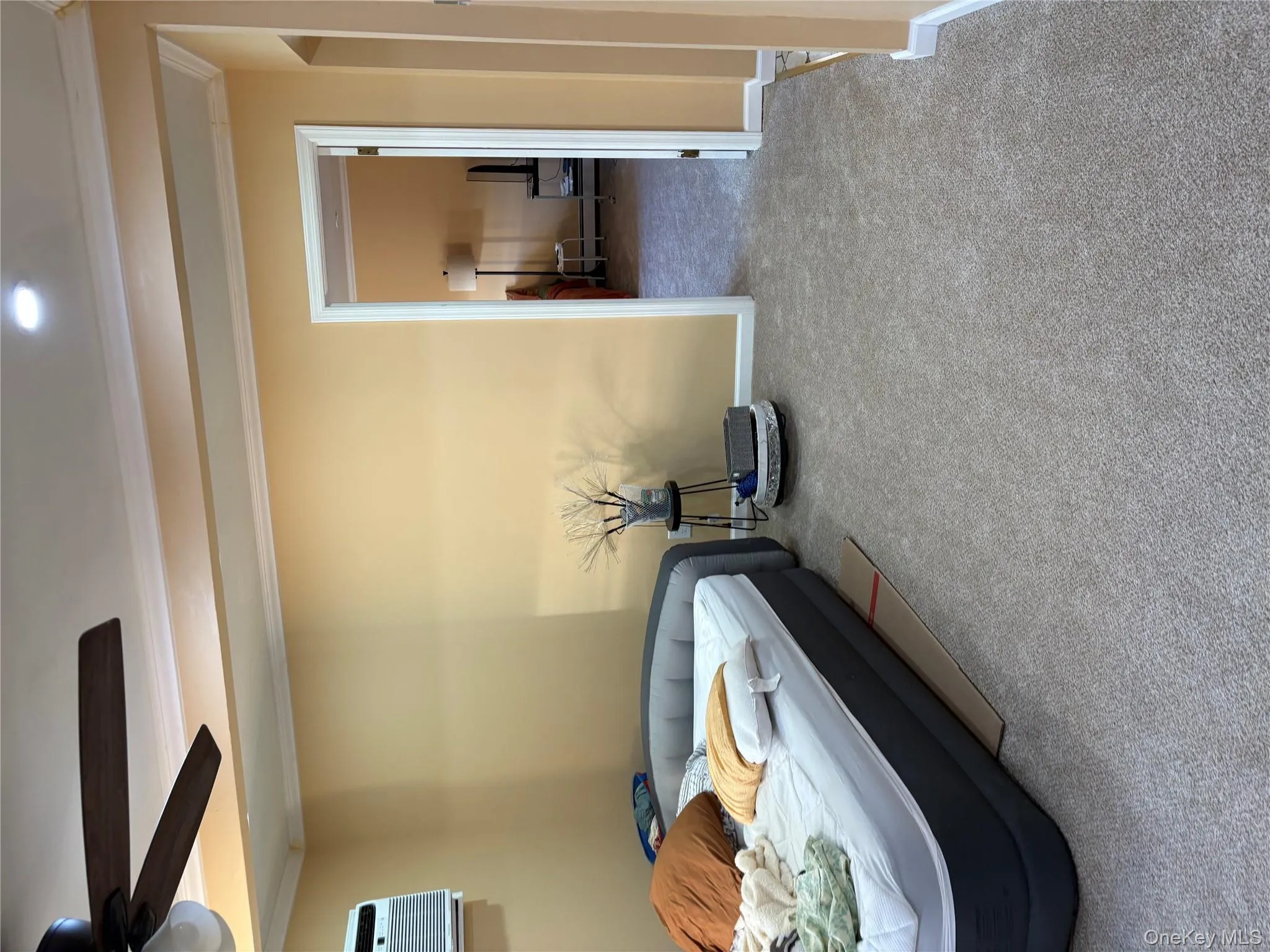 Bedroom featuring carpet flooring, crown molding, and ceiling fan Bedroom featuring carpet flooring, crown molding, and ceiling fan