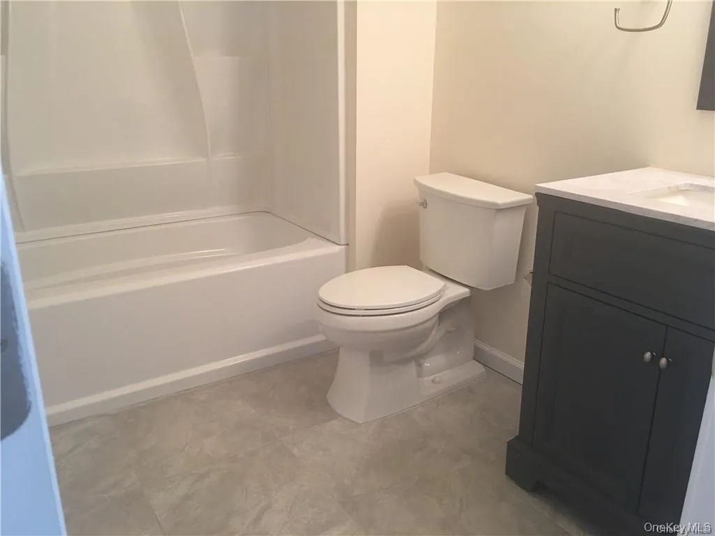 Full bath featuring vanity and shower / washtub combination Full bath featuring vanity and shower / washtub combination