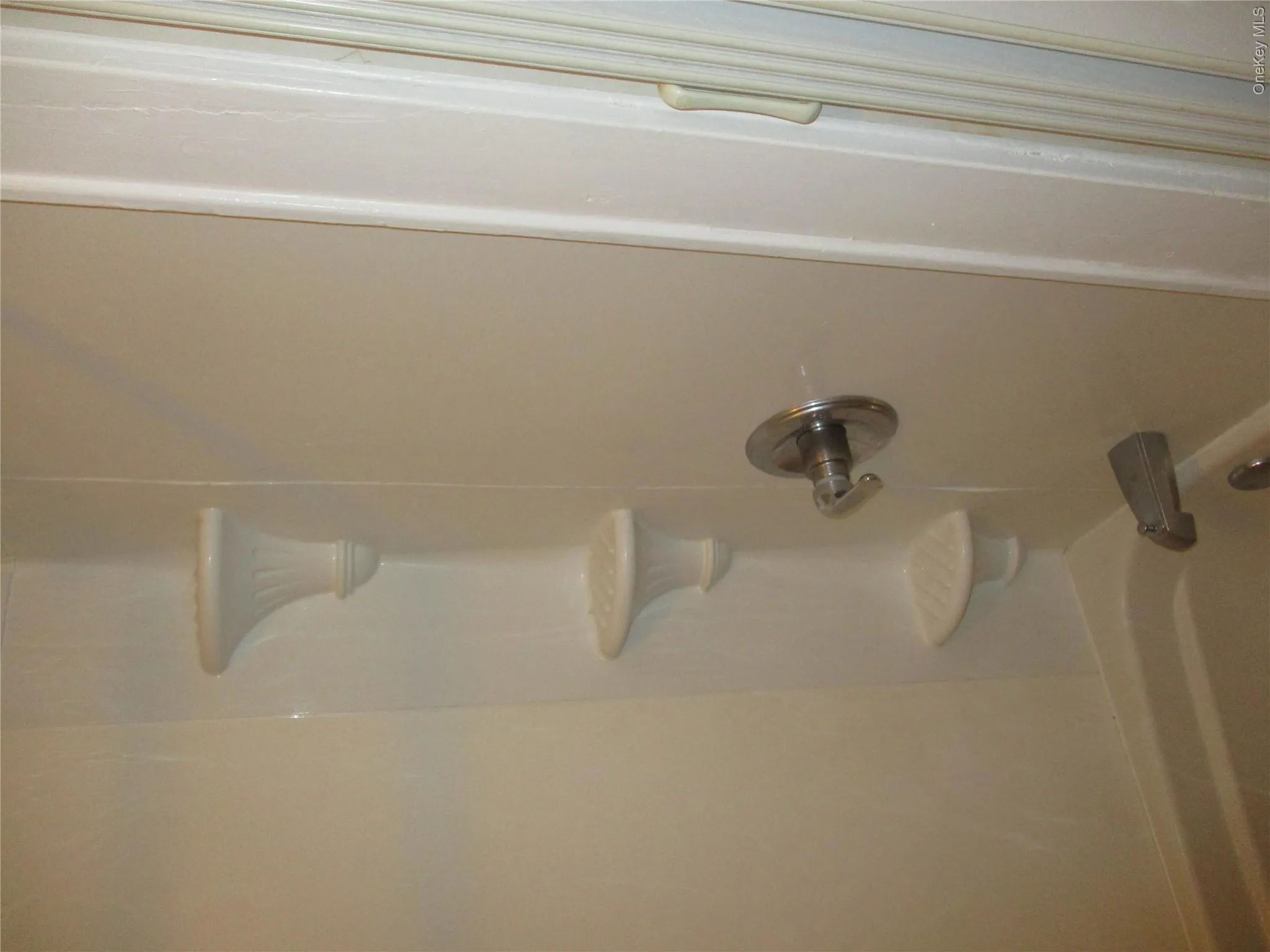 Bathroom view of bathtub / shower combination Bathroom view of bathtub / shower combination