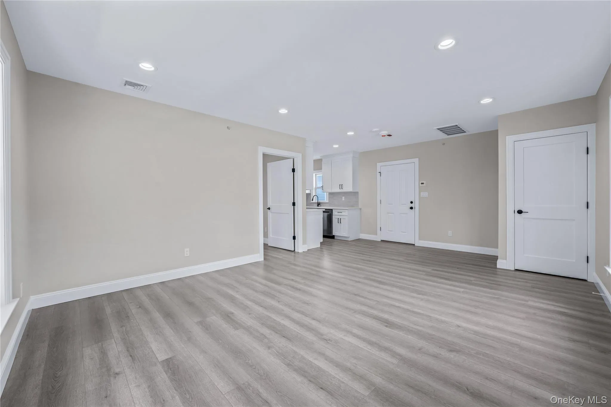 Unfurnished living room featuring recessed lighting and light wood-style flooring Unfurnished living room featuring recessed lighting and light wood-style flooring