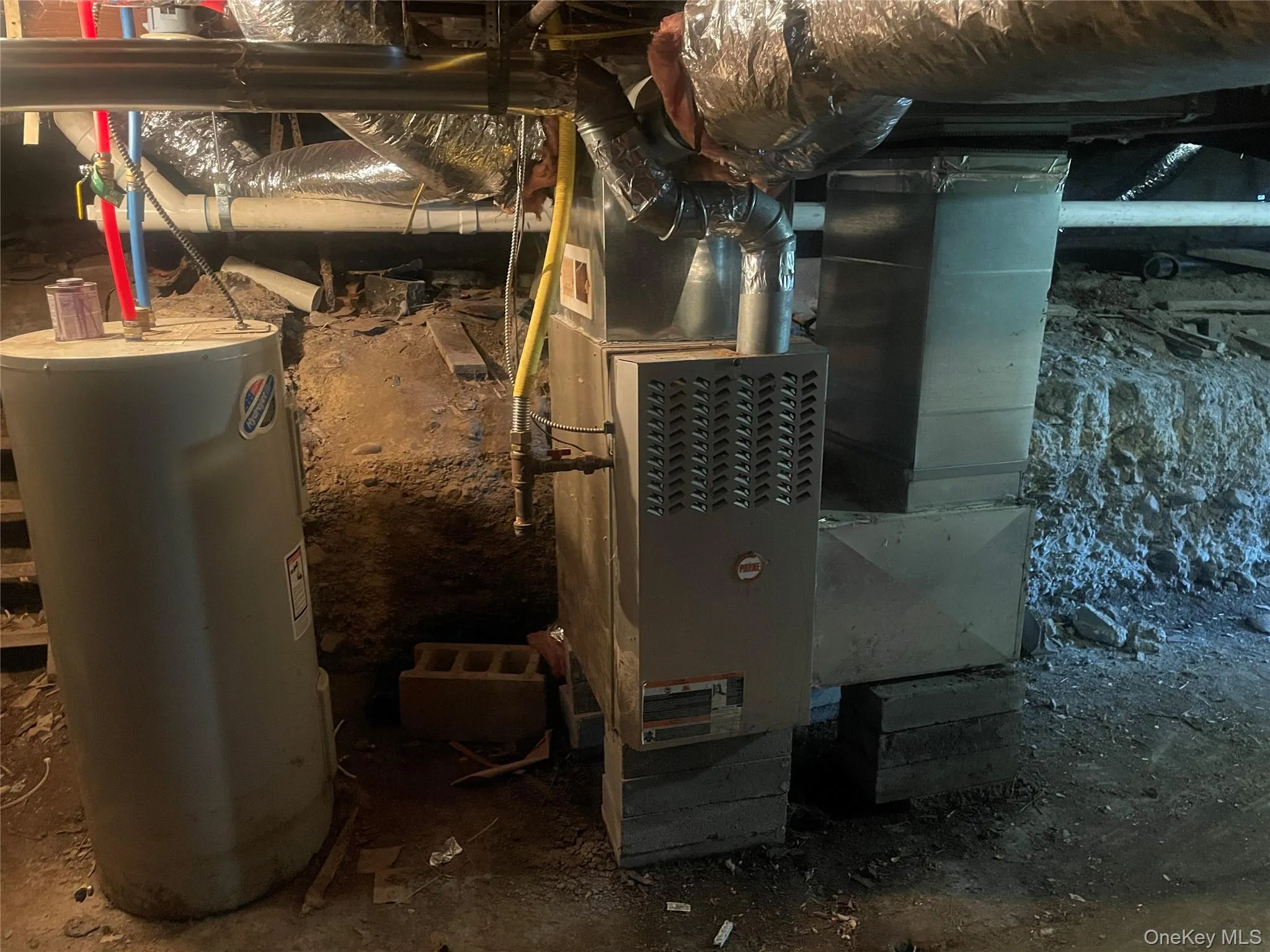 Utilities featuring electric water heater and heating unit Utilities featuring electric water heater and heating unit