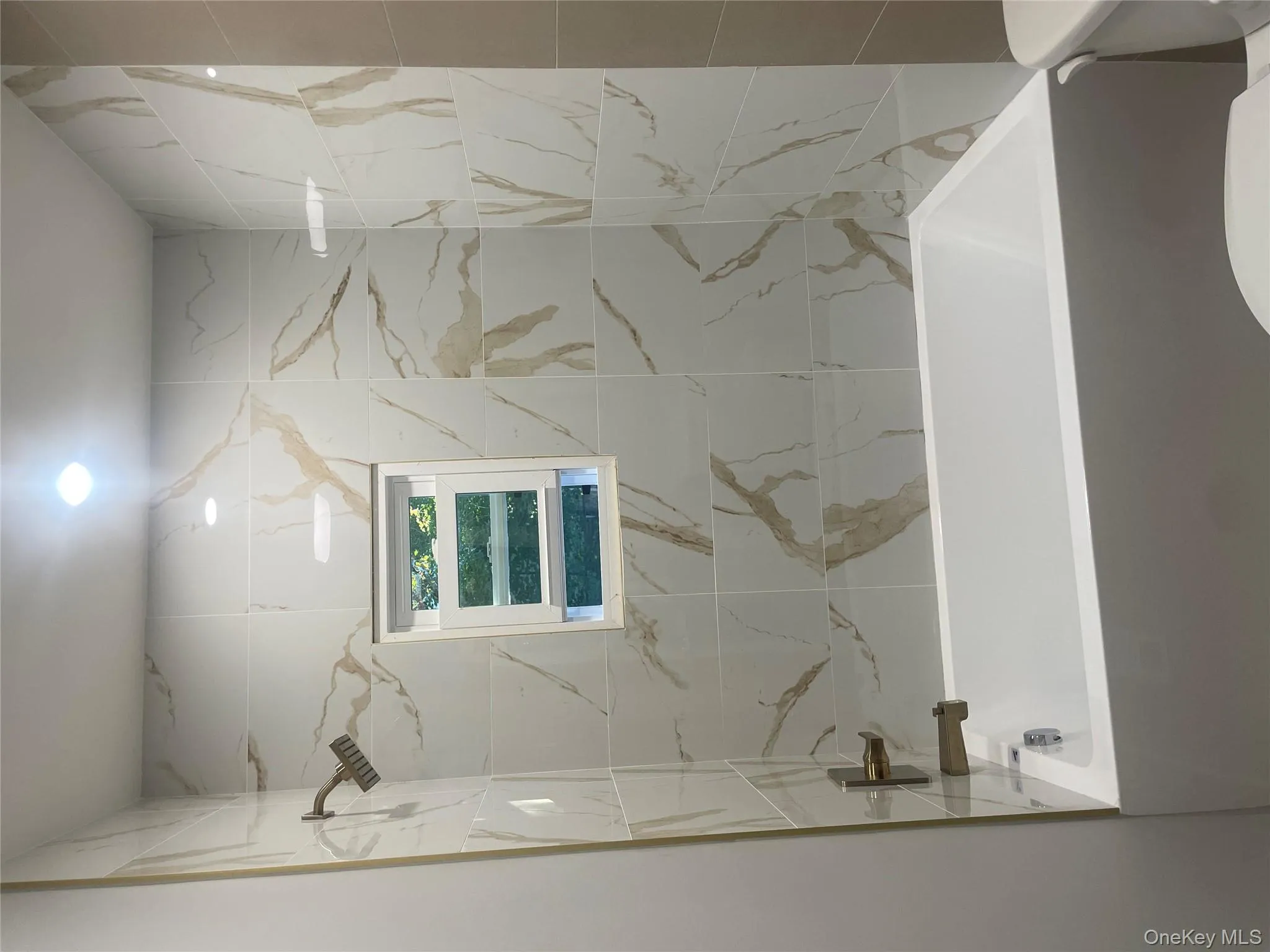 Main Bathroom featuring shower / bath combination Main Bathroom featuring shower / bath combination