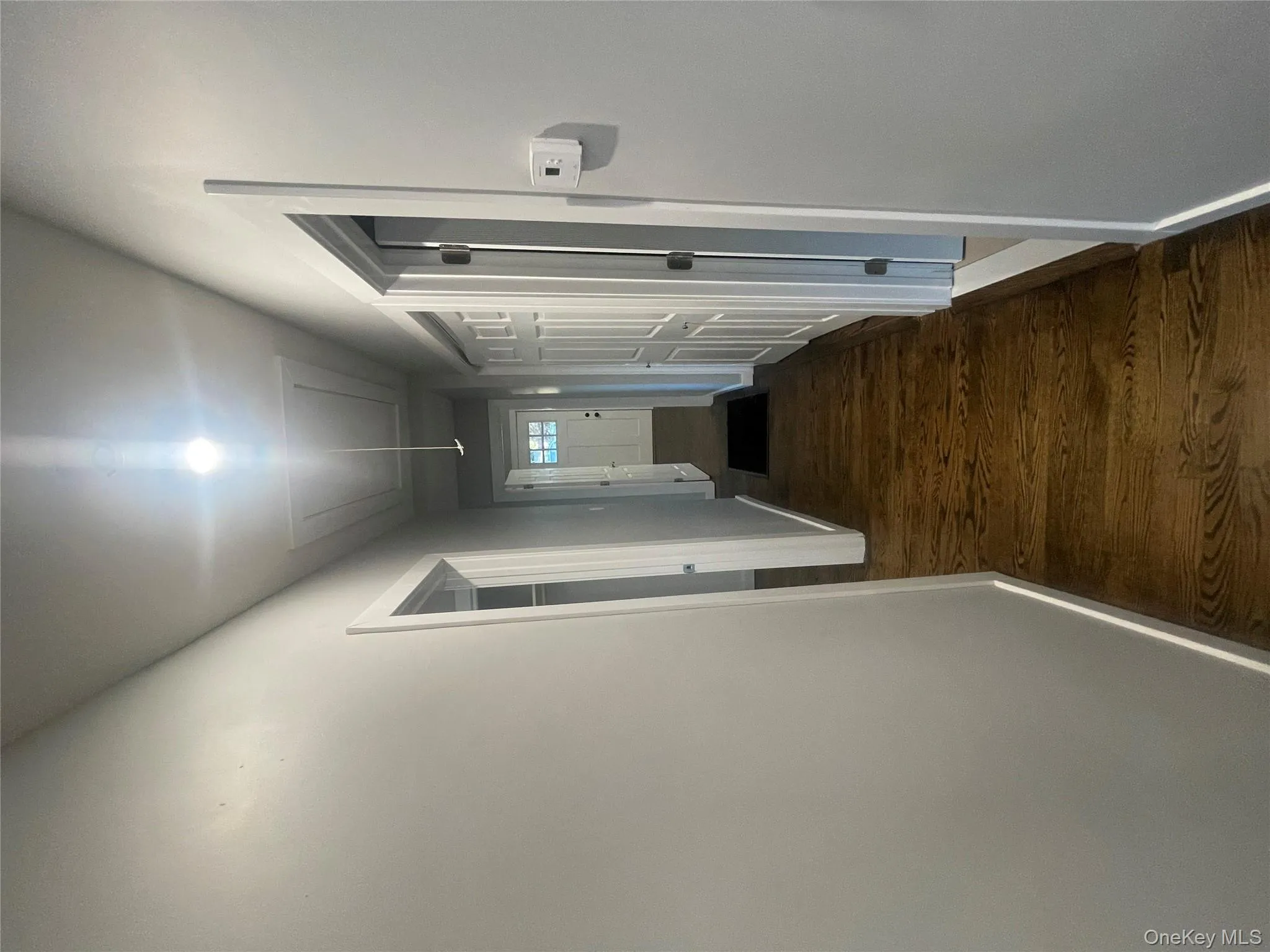 Hall with attic access and dark wood finished floors Hall with attic access and dark wood finished floors