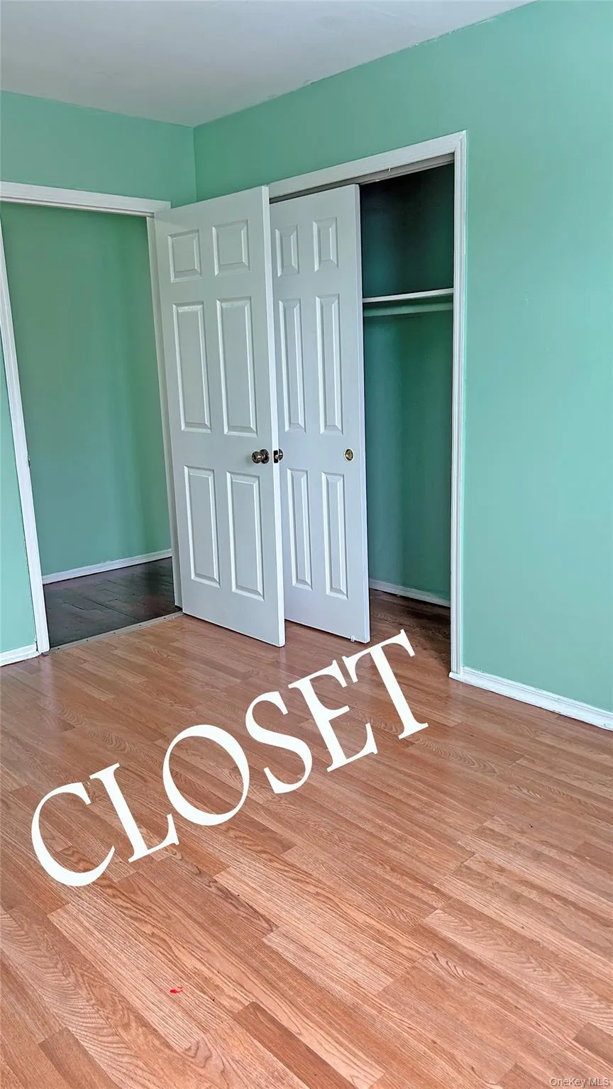 Unfurnished bedroom featuring light wood-style flooring and a closet Unfurnished bedroom featuring light wood-style flooring and a closet