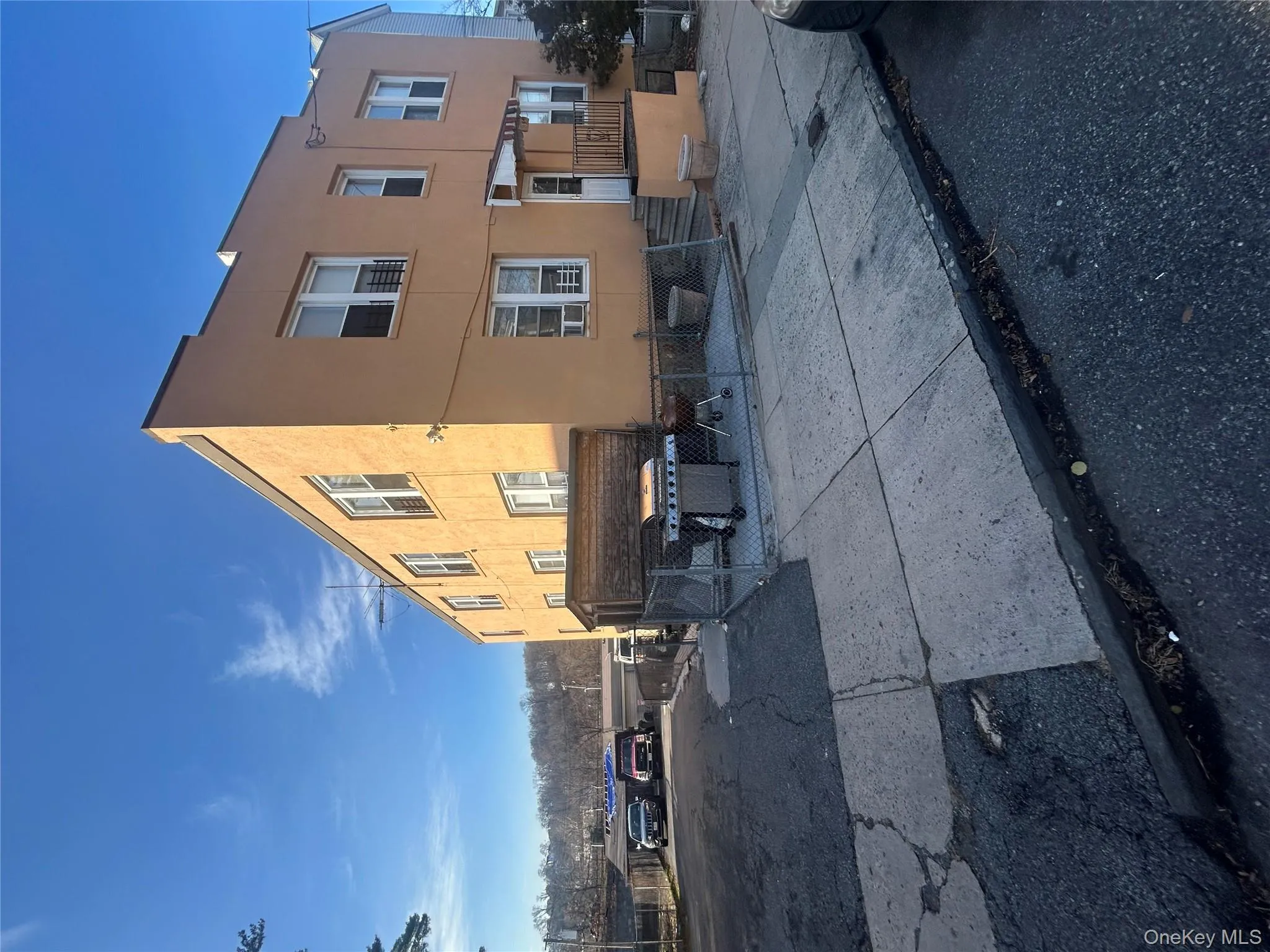 View of property exterior with stucco siding and a fenced front yard View of property exterior with stucco siding and a fenced front yard