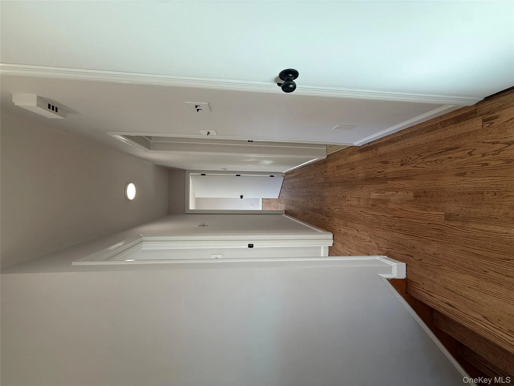 Hall featuring baseboards and dark wood finished floors Hall featuring baseboards and dark wood finished floors