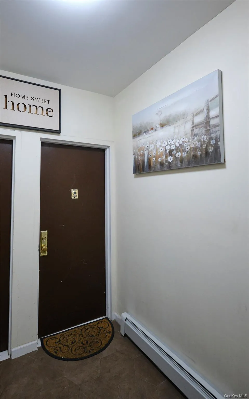 Entryway with a baseboard radiator and baseboards Entryway with a baseboard radiator and baseboards