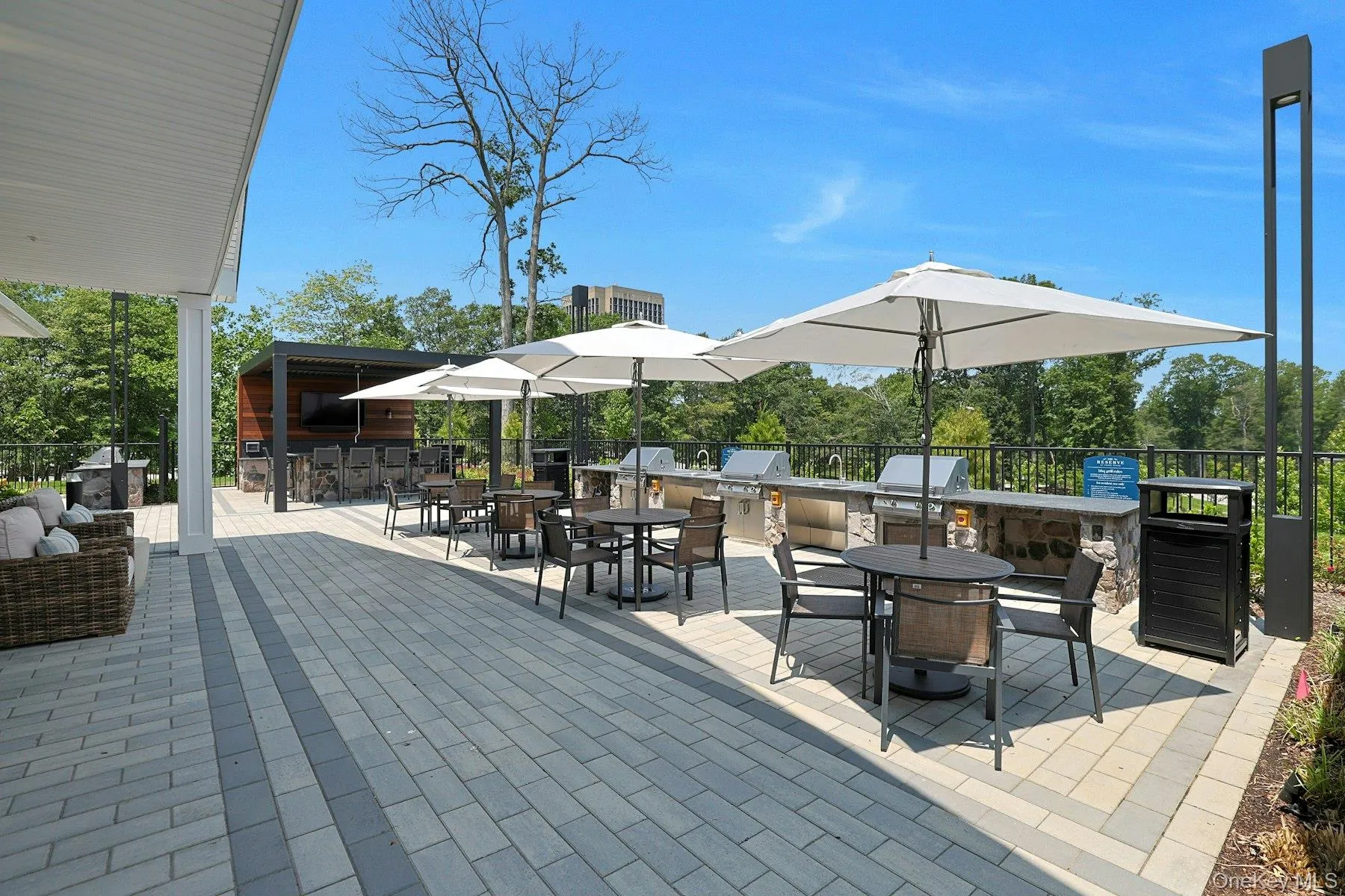 View of patio featuring an outdoor BBQ's, kitchen exterior bar, and outdoor dining space View of patio featuring an outdoor BBQ's, kitchen exterior bar, and outdoor dining space