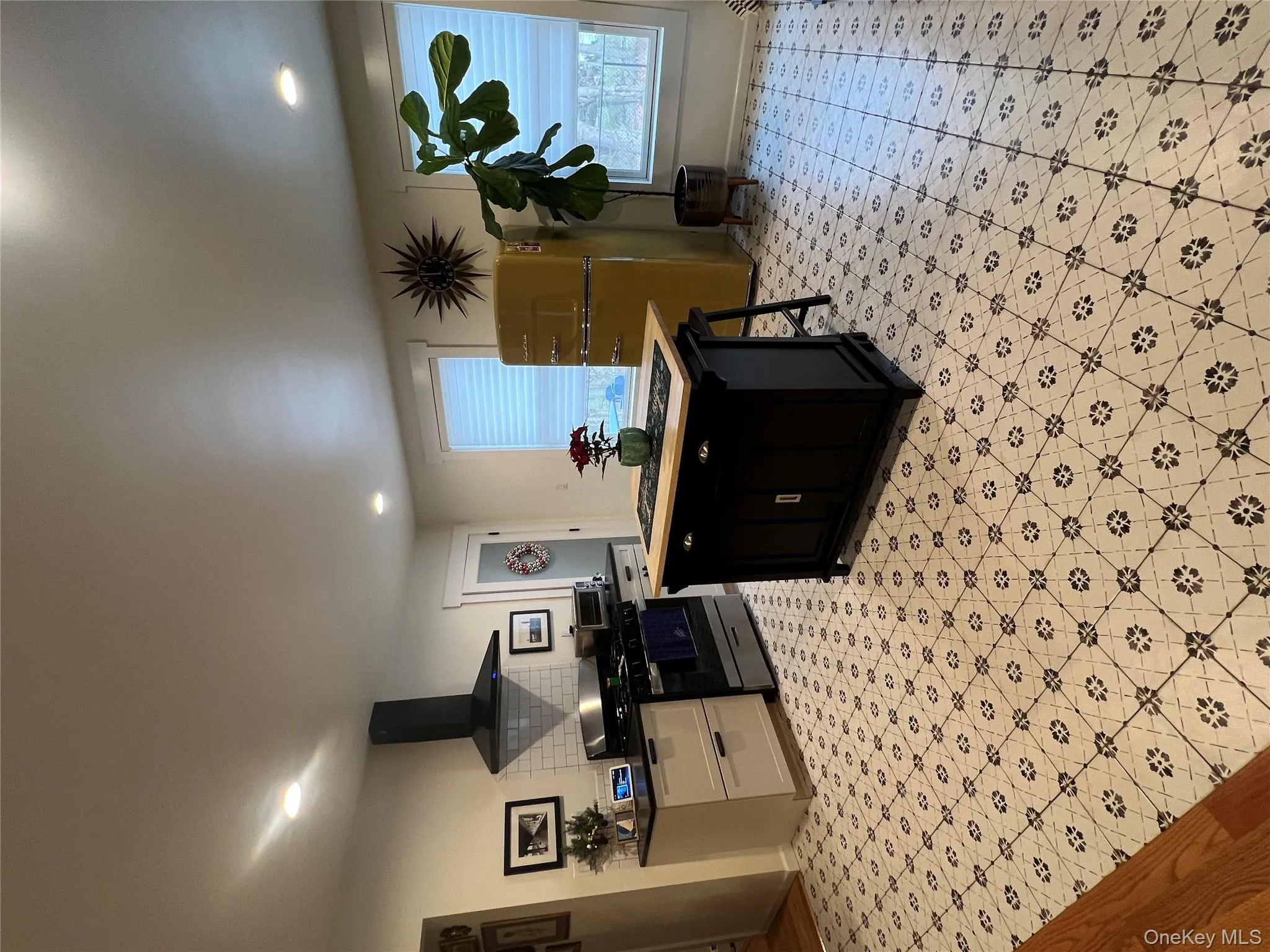 Kitchen featuring range, ventilation hood, fridge, plenty of natural light, and recessed lighting Kitchen featuring range, ventilation hood, fridge, plenty of natural light, and recessed lighting