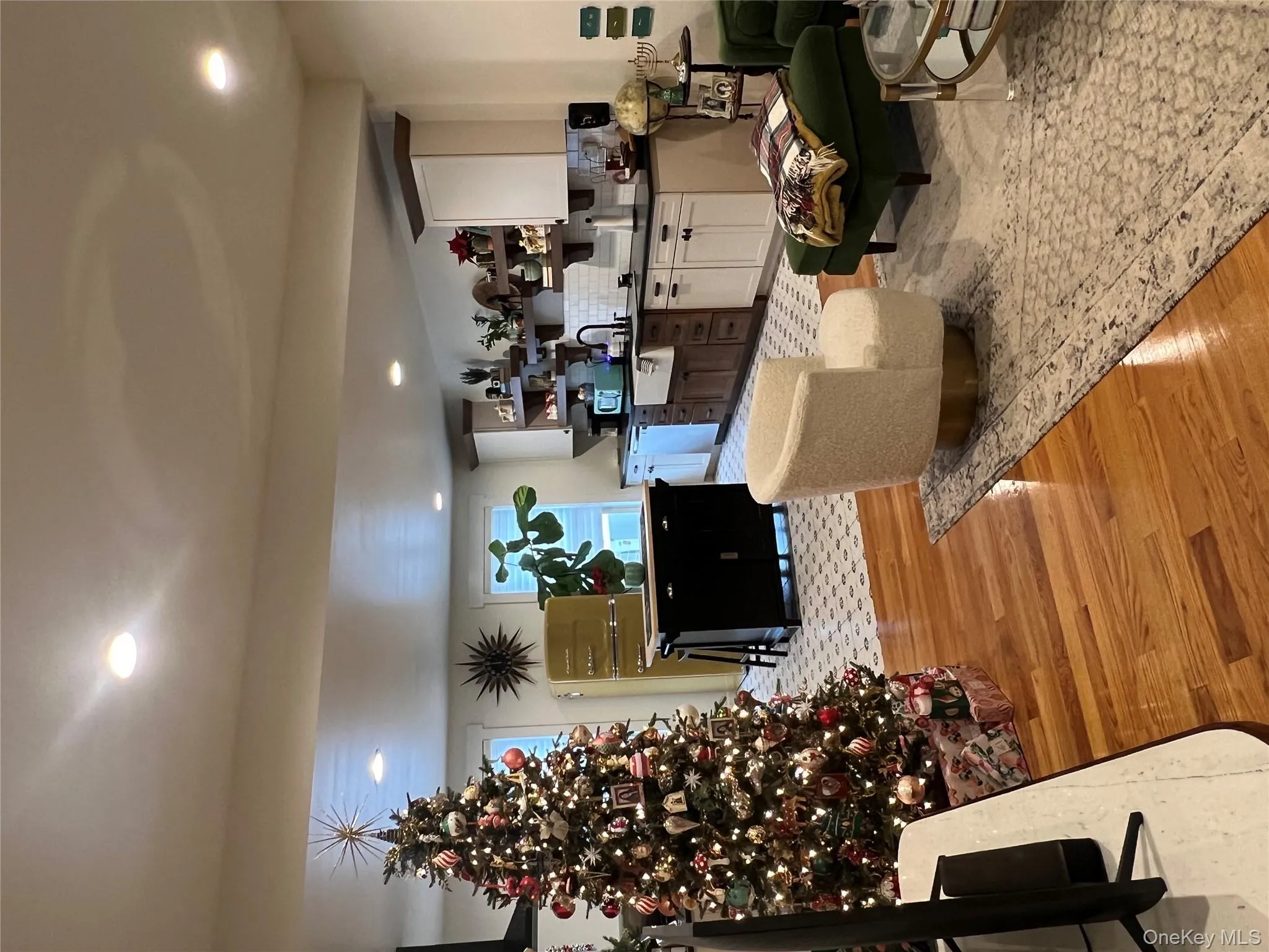 Living room featuring light wood-style flooring and recessed lighting Living room featuring light wood-style flooring and recessed lighting