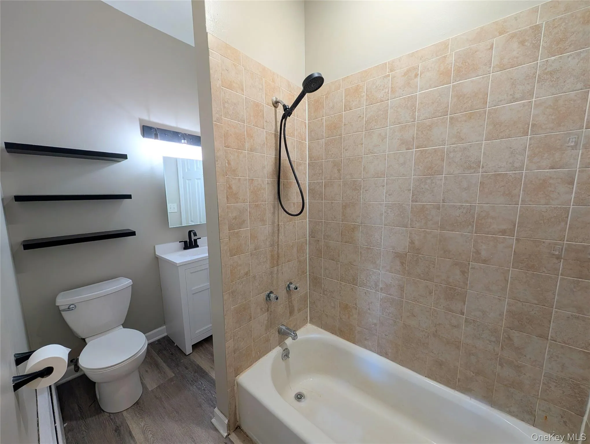 Bathroom featuring tub / shower combination, and vanity. Bathroom featuring tub / shower combination, and vanity.
