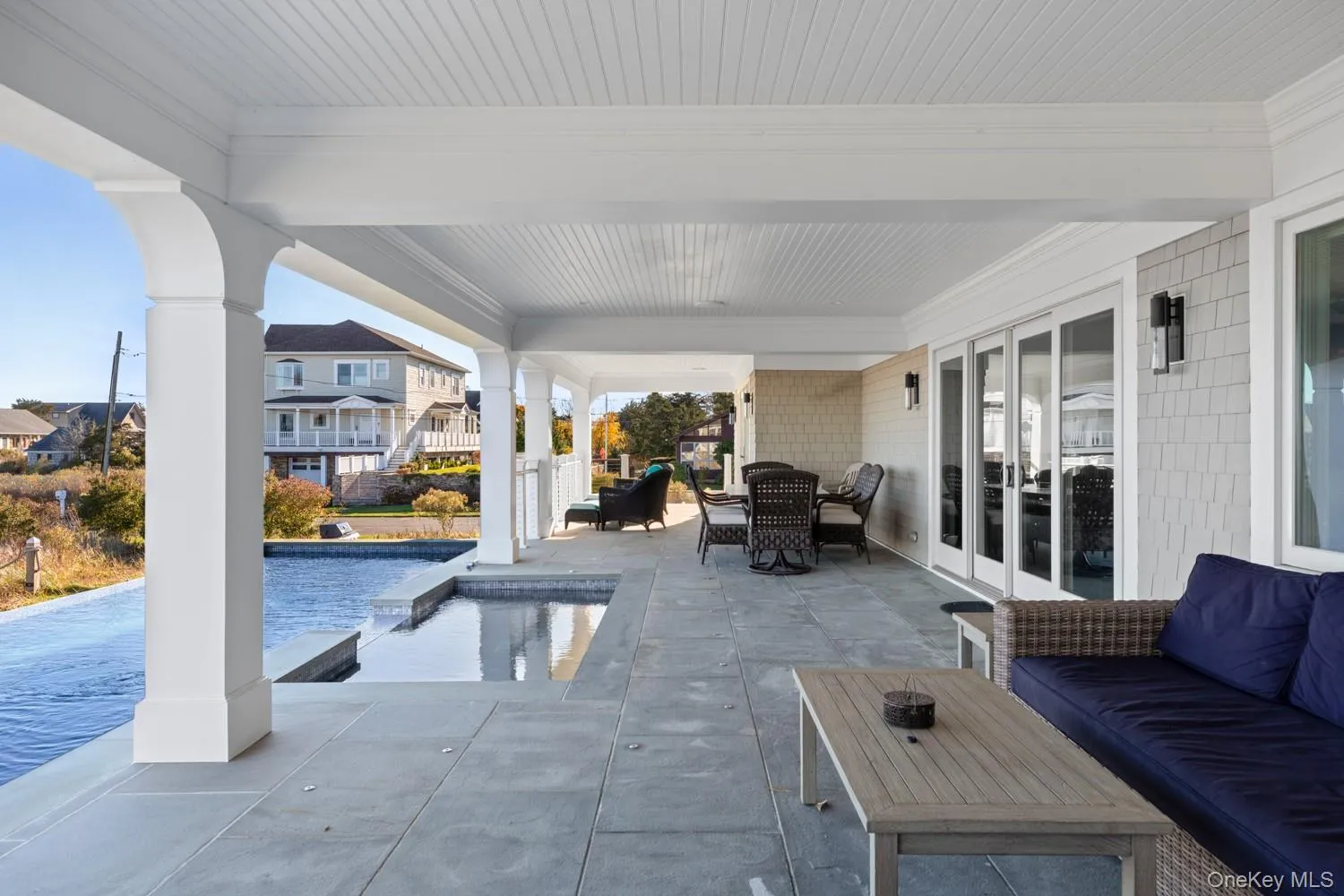 View of patio / terrace with an outdoor hangout area and a pool with connected hot tub View of patio / terrace with an outdoor hangout area and a pool with connected hot tub