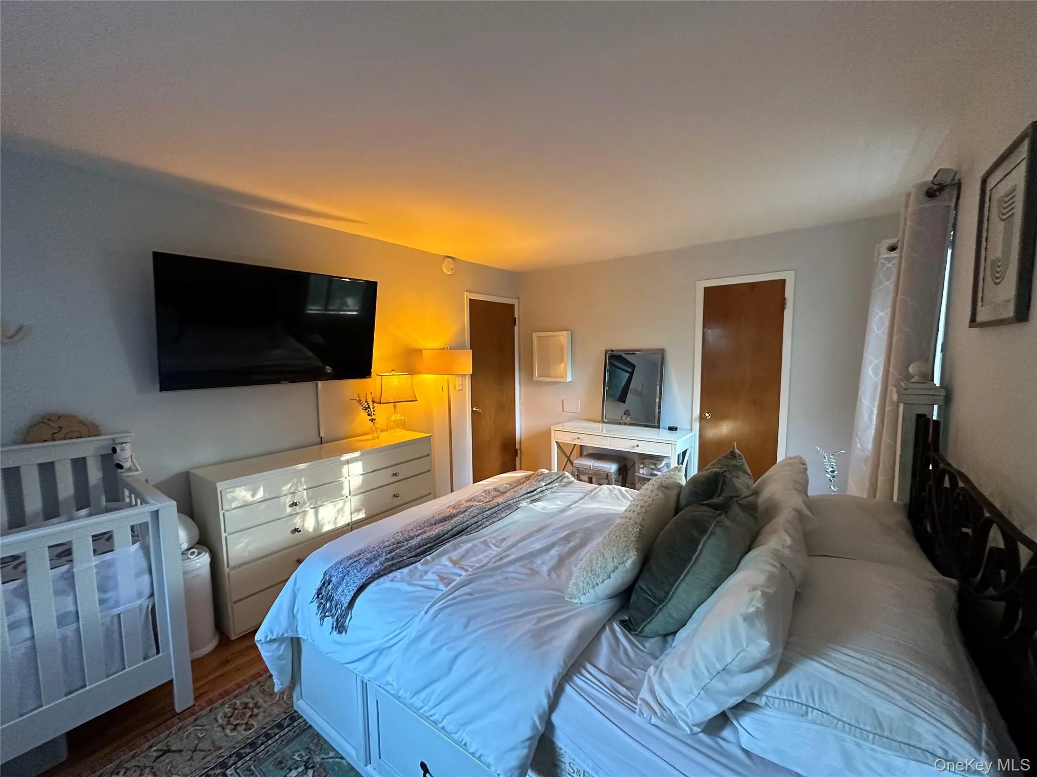 Bedroom with wood finished floors Bedroom with wood finished floors