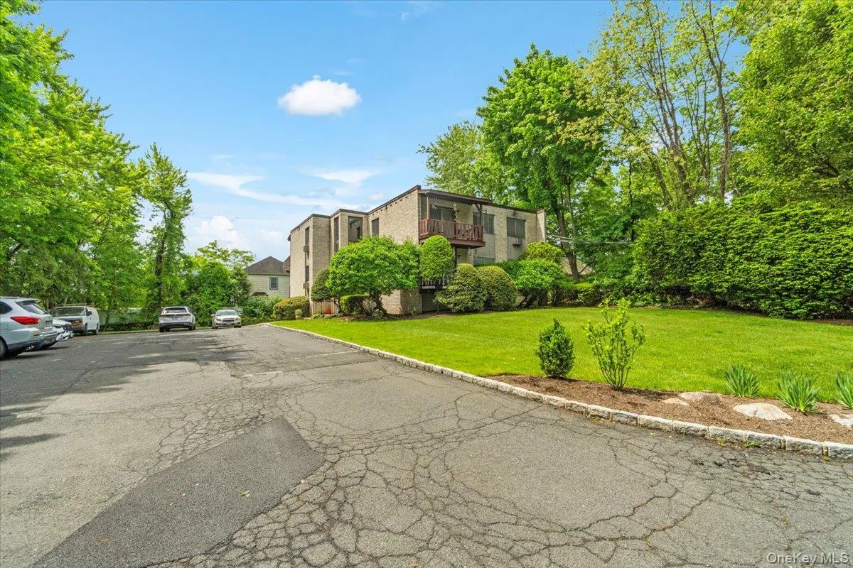 View of asphalt road with curbs View of asphalt road with curbs