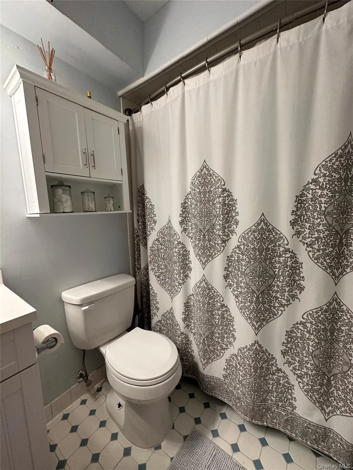 Bathroom with a shower with curtain and vanity Bathroom with a shower with curtain and vanity