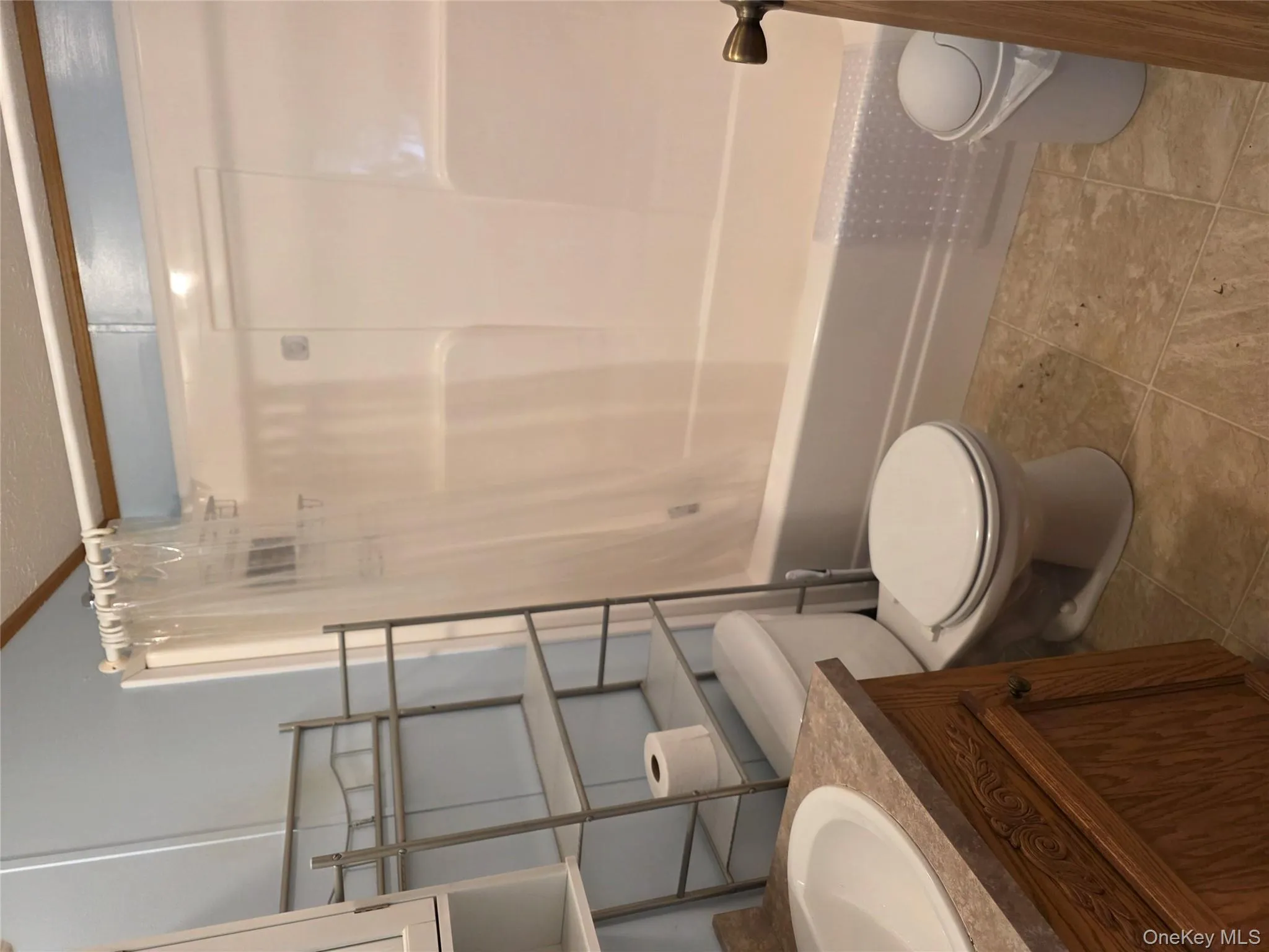 Full bath featuring shower / tub combo and vanity Full bath featuring shower / tub combo and vanity