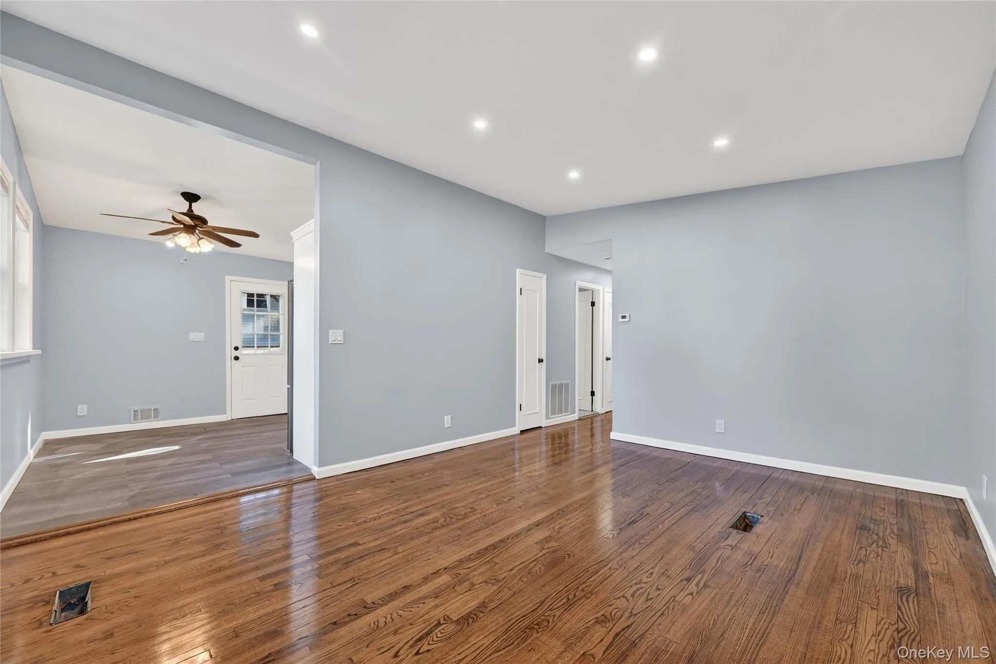 Spare room featuring recessed lighting, dark wood-style floors, and ceiling fan Spare room featuring recessed lighting, dark wood-style floors, and ceiling fan