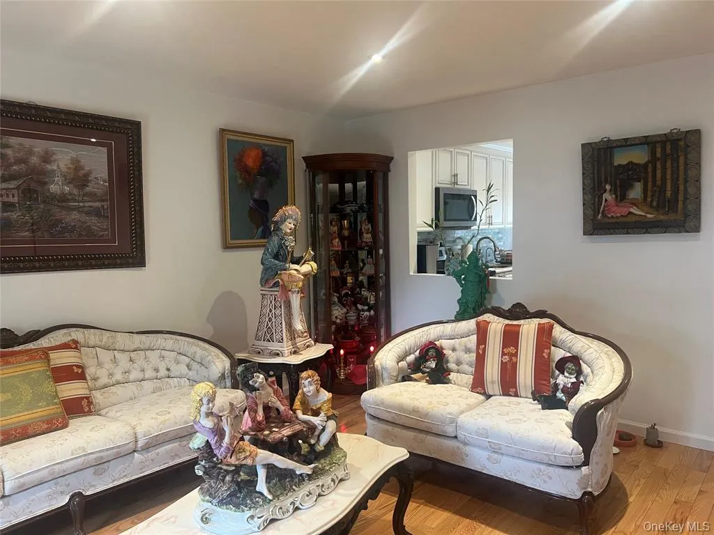 Living area featuring wood finished floors and baseboards Living area featuring wood finished floors and baseboards