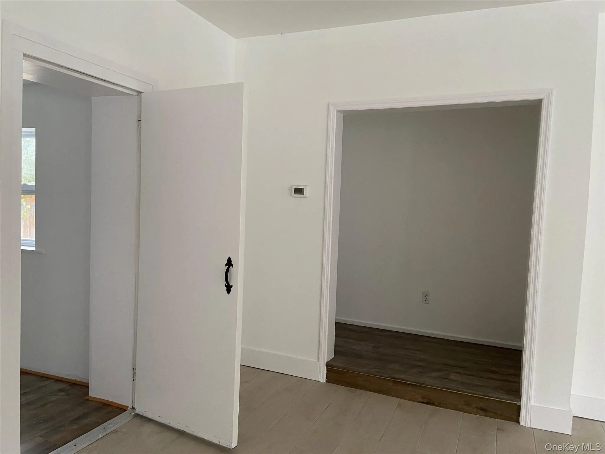 Unfurnished bedroom featuring light wood-style flooring and baseboards Unfurnished bedroom featuring light wood-style flooring and baseboards