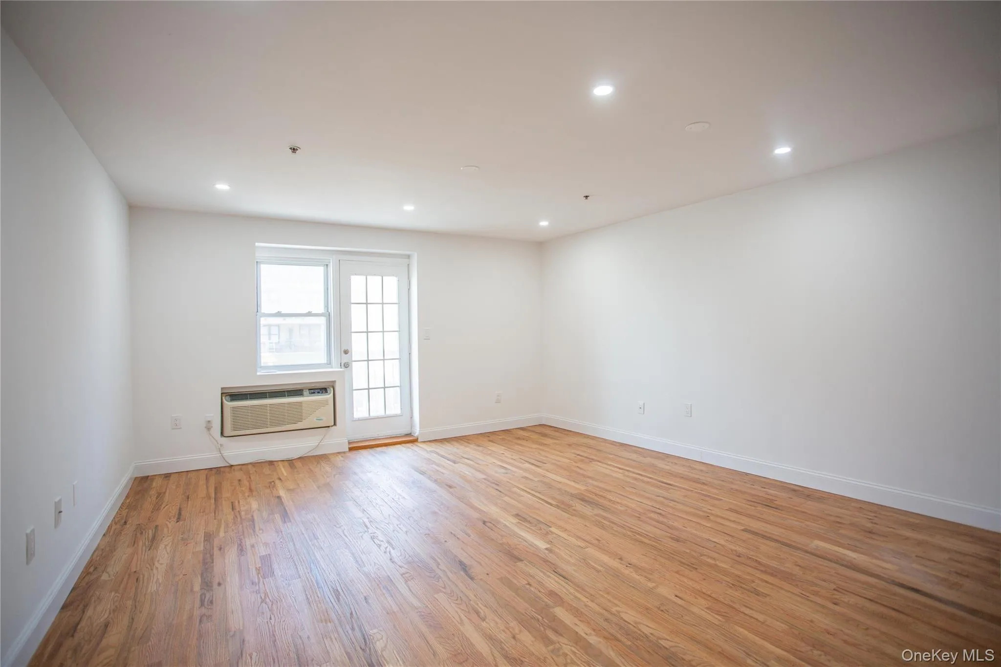 Empty room featuring light wood-type flooring and recessed lighting Empty room featuring light wood-type flooring and recessed lighting
