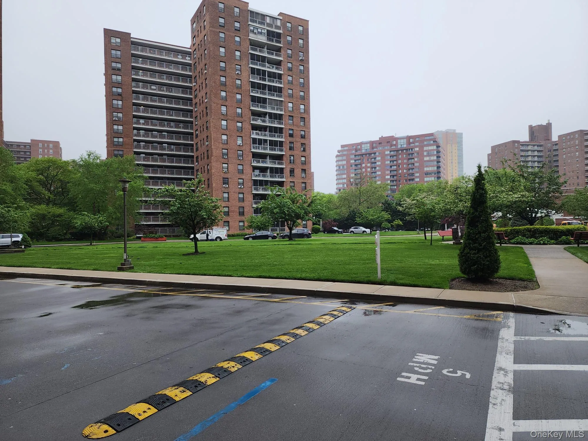 View of apartment building / complex with uncovered parking and a view of city View of apartment building / complex with uncovered parking and a view of city