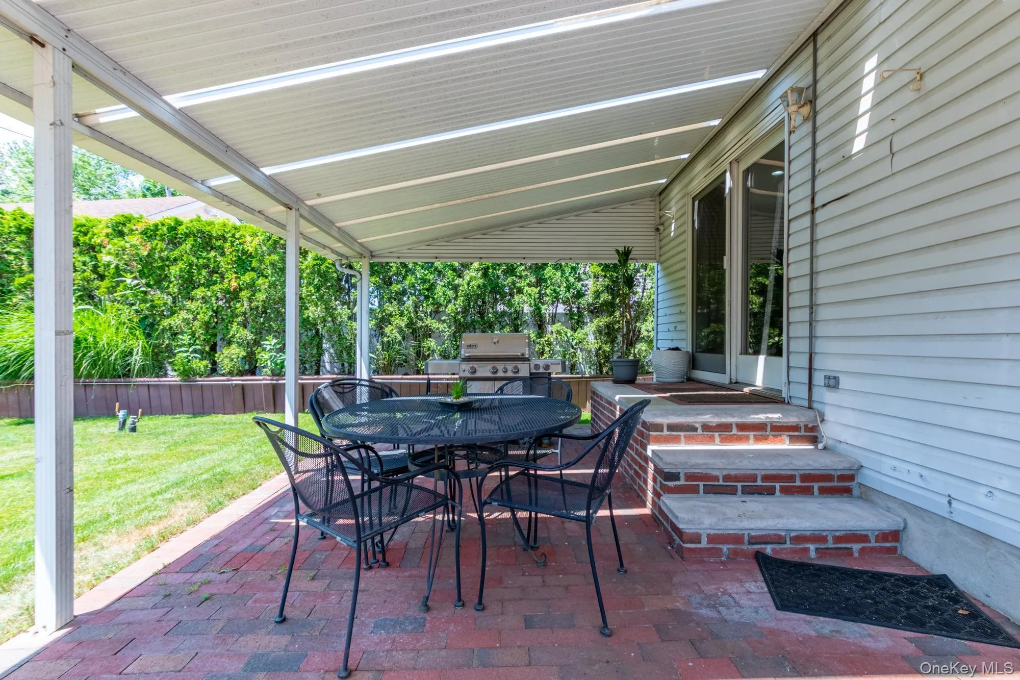 View of patio featuring outdoor dining space and grilling area View of patio featuring outdoor dining space and grilling area