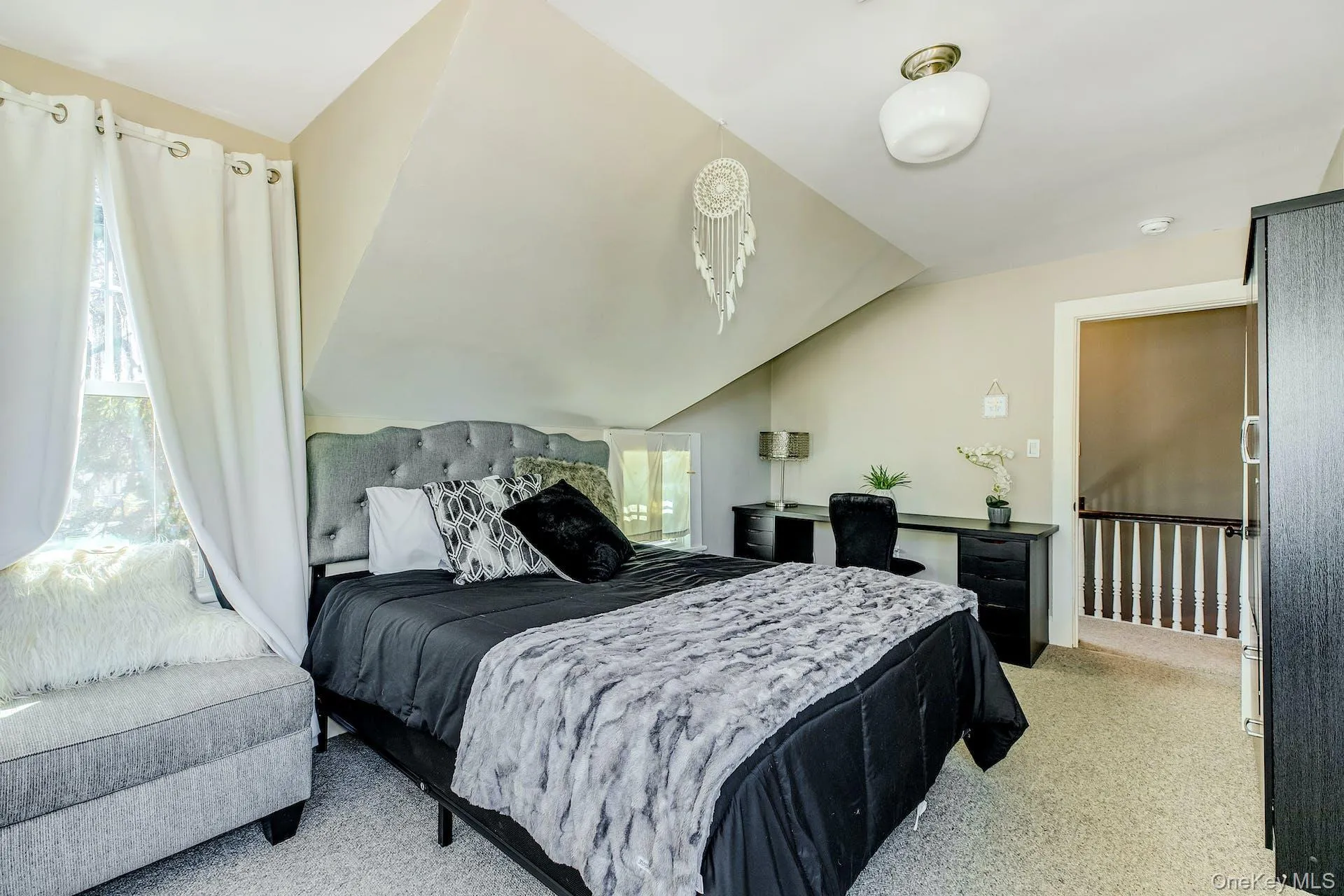 Bedroom with lofted ceiling Bedroom with lofted ceiling