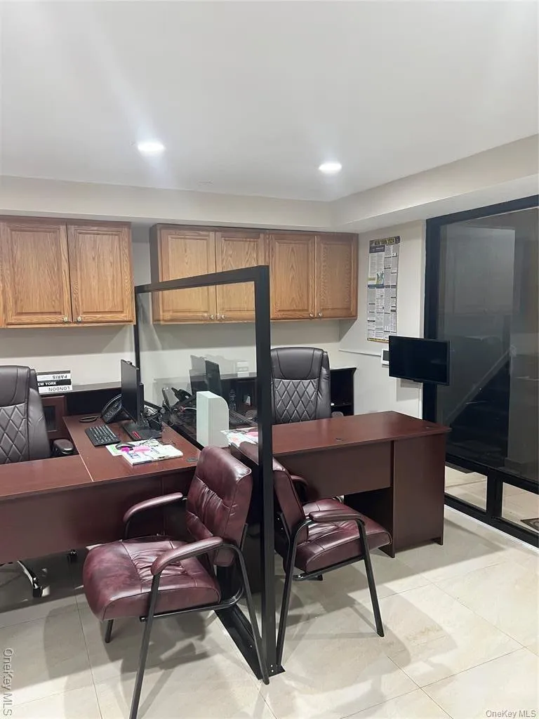 Office featuring recessed lighting and light tile patterned floors Office featuring recessed lighting and light tile patterned floors