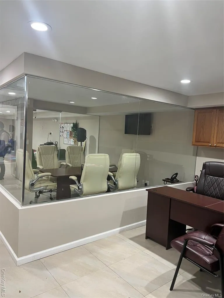 Office with light tile patterned floors Office with light tile patterned floors